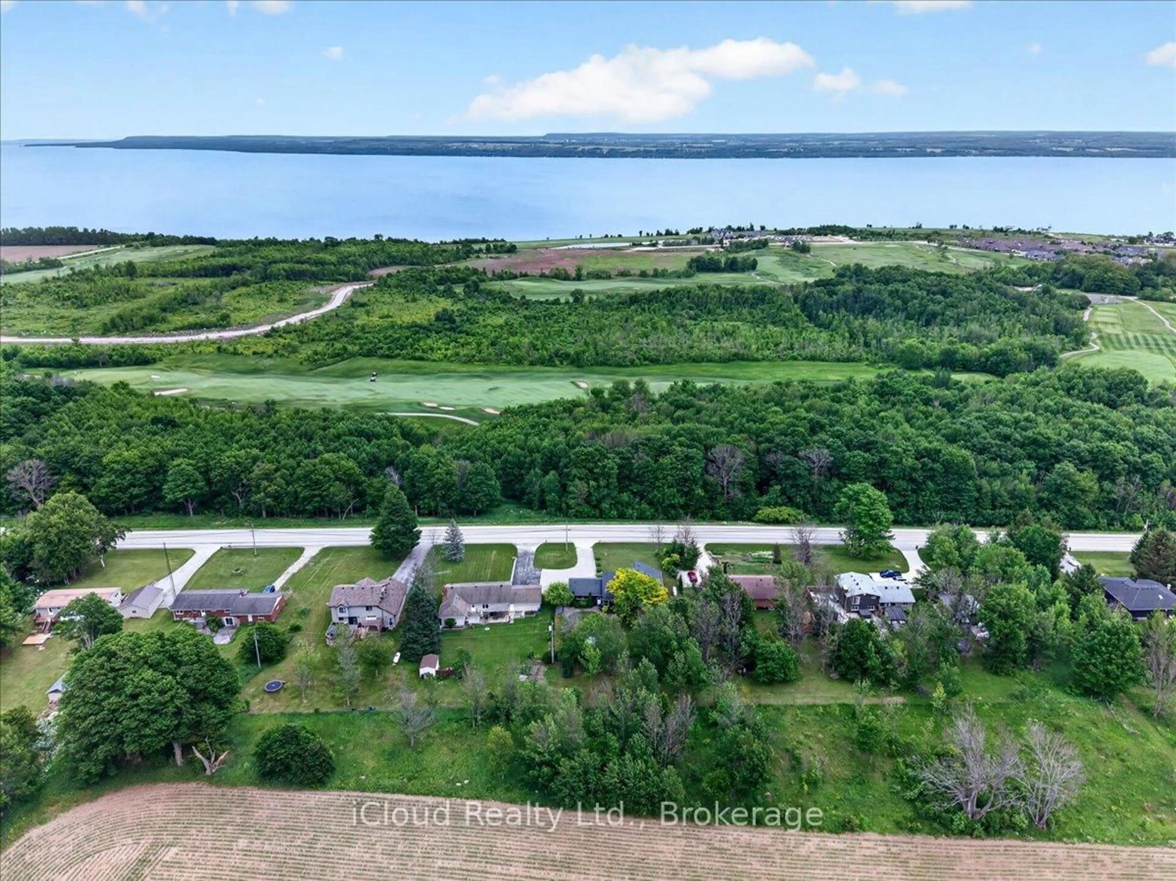 A pic from outside/outdoor area/front of a property/back of a property/a pic from drone, water/lake/river/ocean view for 319378 Grey Road 1, Georgian Bluffs Ontario N0H 1S0
