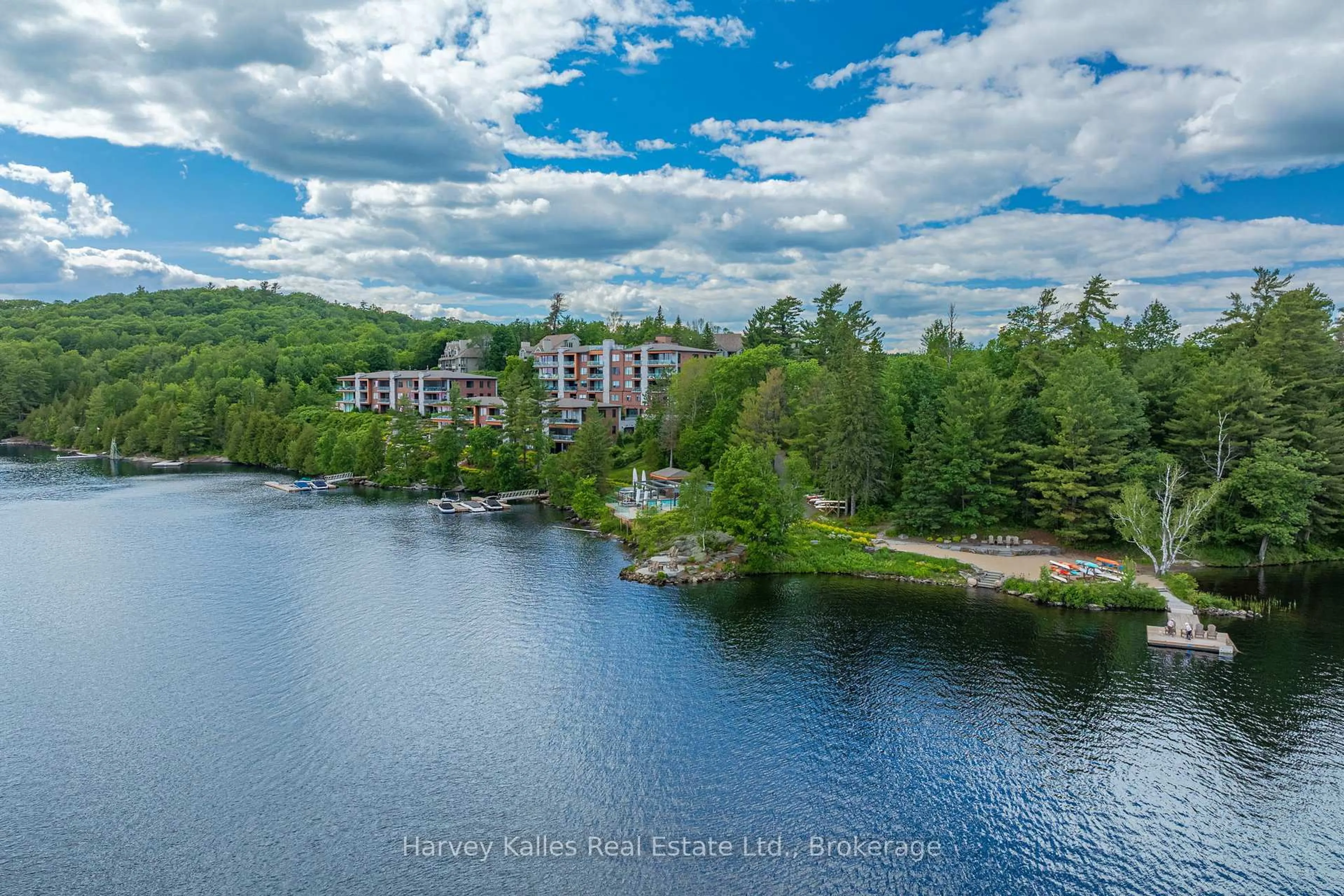 A pic from outside/outdoor area/front of a property/back of a property/a pic from drone, water/lake/river/ocean view for 727 Grandview Dr #306, Huntsville Ontario P1H 1B2