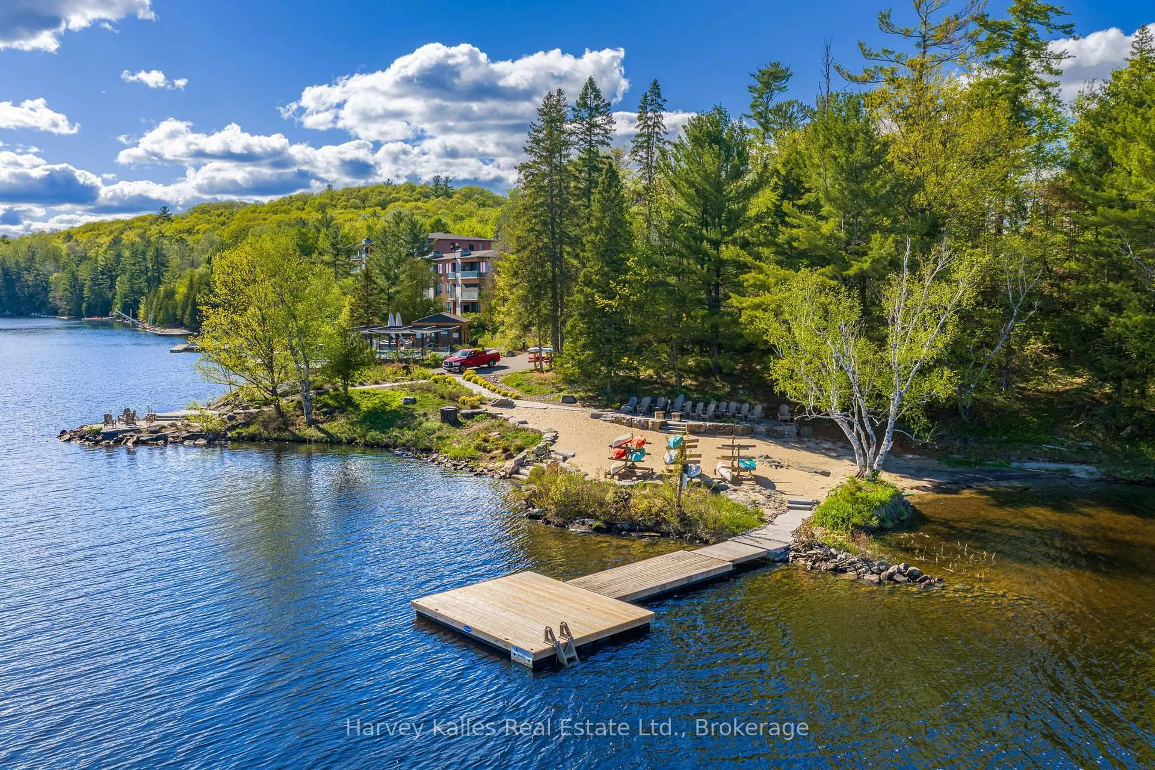 A pic from outside/outdoor area/front of a property/back of a property/a pic from drone, water/lake/river/ocean view for 727 Grandview Dr #306, Huntsville Ontario P1H 1B2