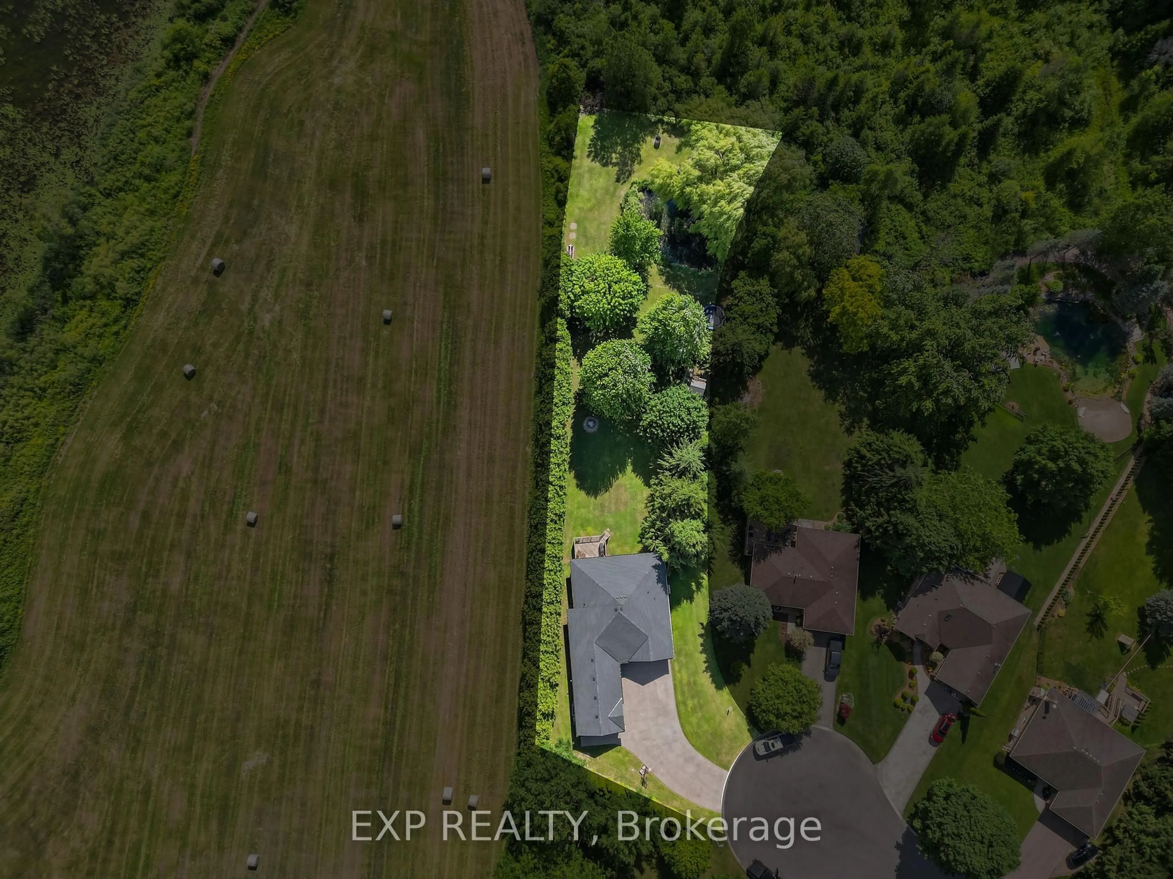 A pic from outside/outdoor area/front of a property/back of a property/a pic from drone, forest/trees view for 128 Brookfield St, Middlesex Centre Ontario N0M 1P0