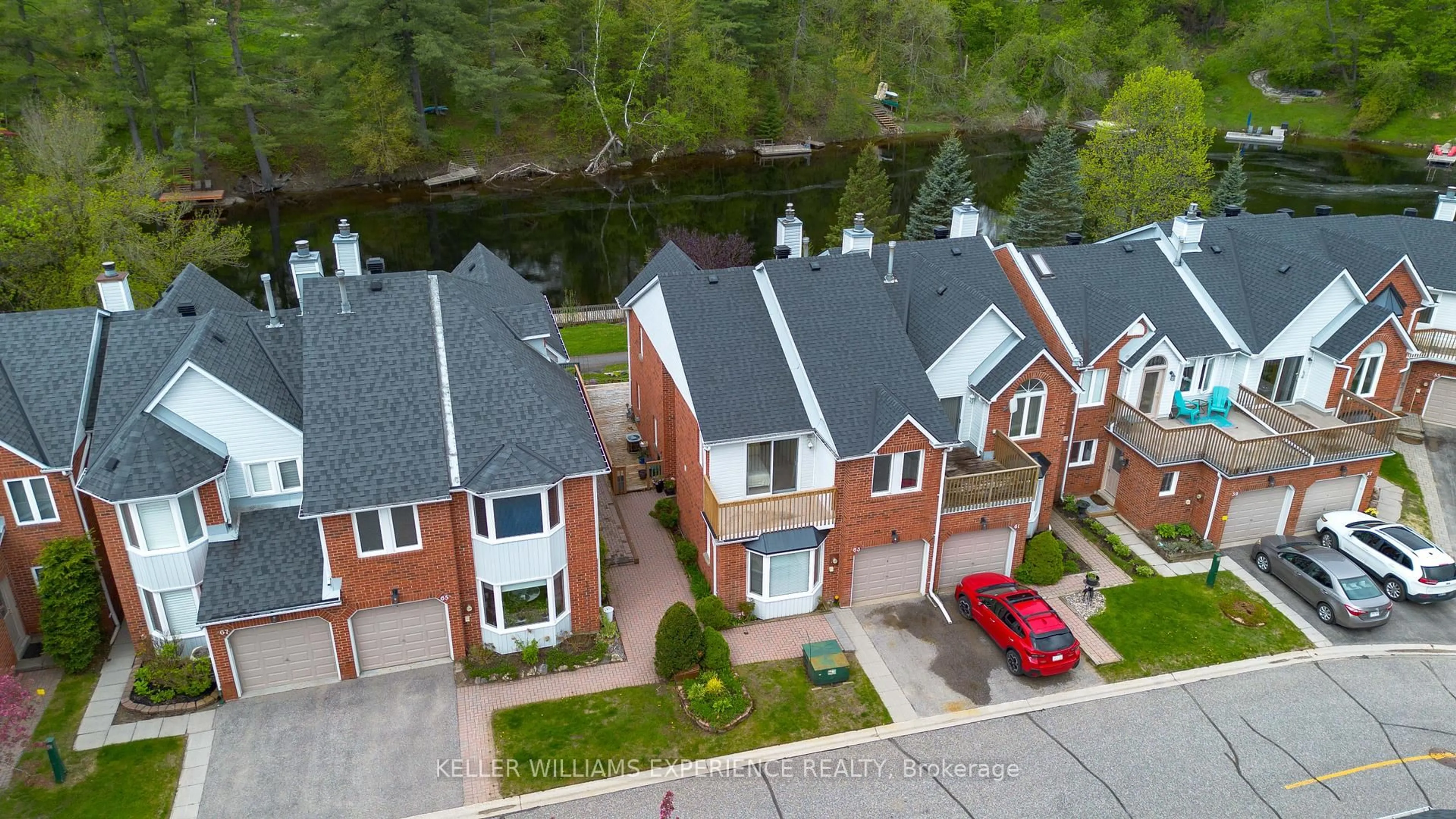 A pic from outside/outdoor area/front of a property/back of a property/a pic from drone, water/lake/river/ocean view for 63 Shoreline Dr, Bracebridge Ontario P1L 1Z3