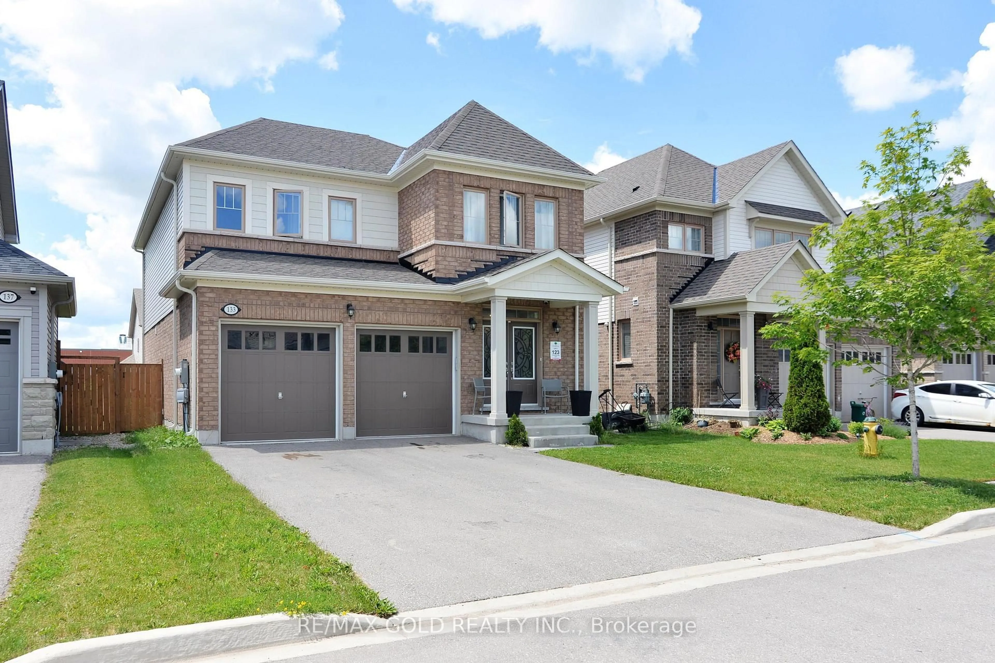Home with brick exterior material, street for 133 Harpin Way, Centre Wellington Ontario N1M 0G9