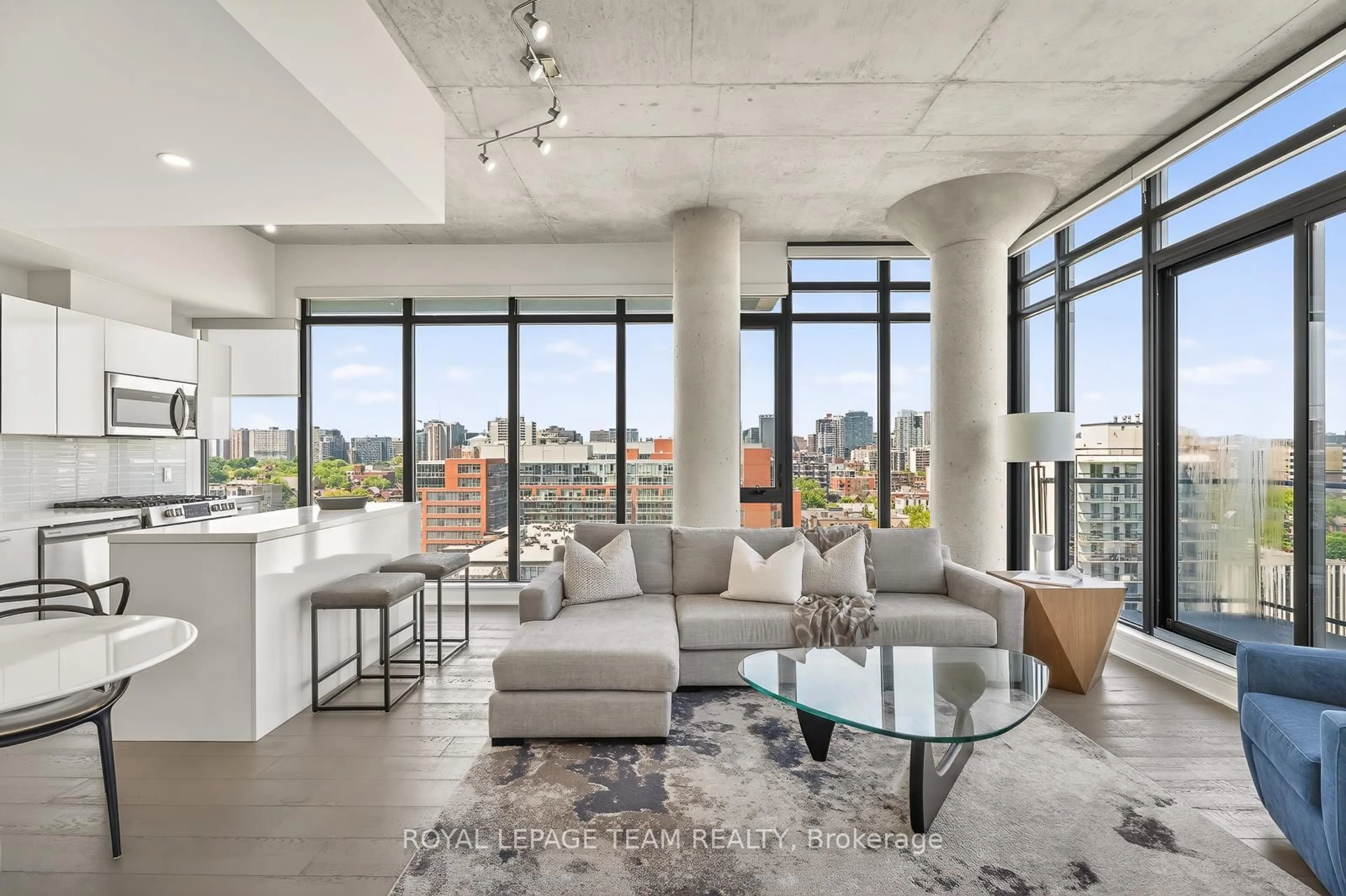 Living room with furniture, cement floor for 203 CATHERINE St #1009, Ottawa Ontario K2P 1J5