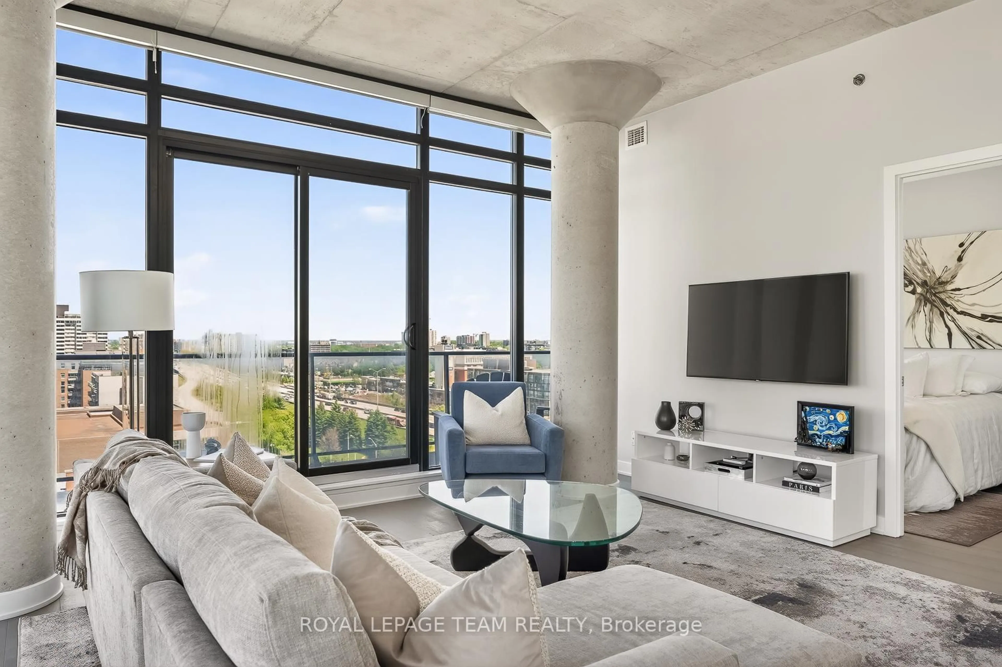 Living room with furniture, cement floor for 203 CATHERINE St #1009, Ottawa Ontario K2P 1J5