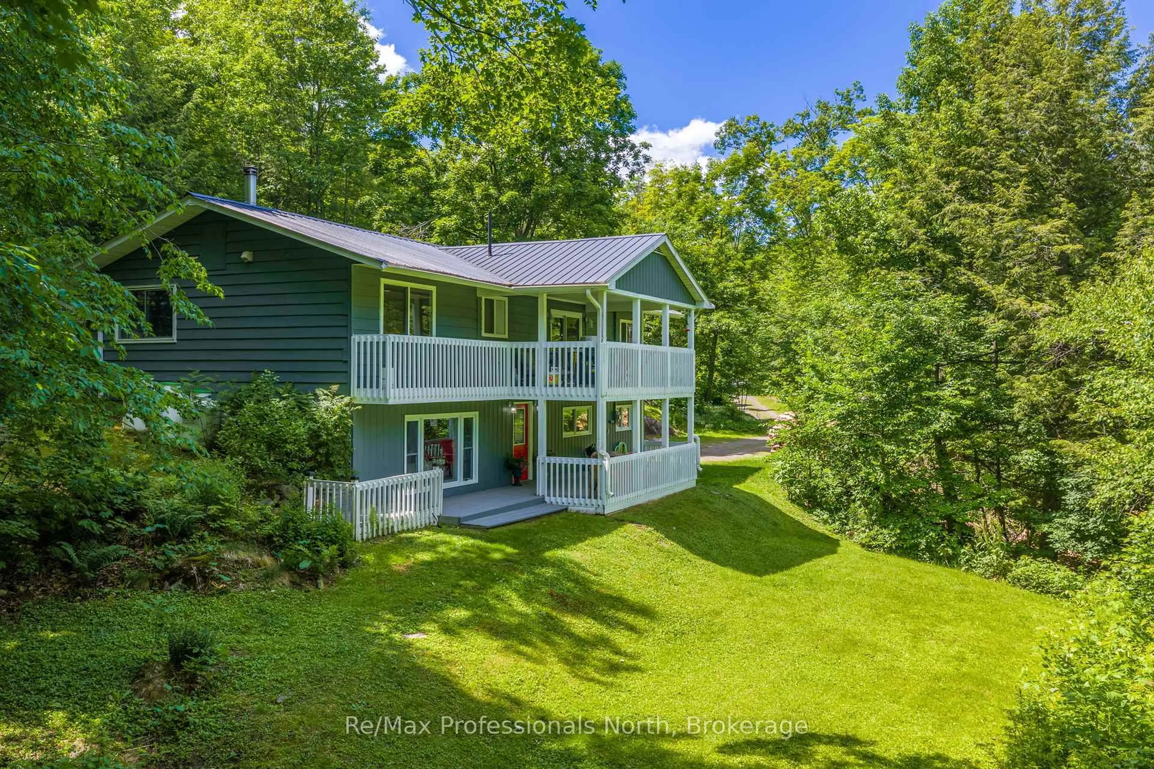 A pic from outside/outdoor area/front of a property/back of a property/a pic from drone, water/lake/river/ocean view for 1032 Bradley Rd, Muskoka Lakes Ontario P1P 1R2