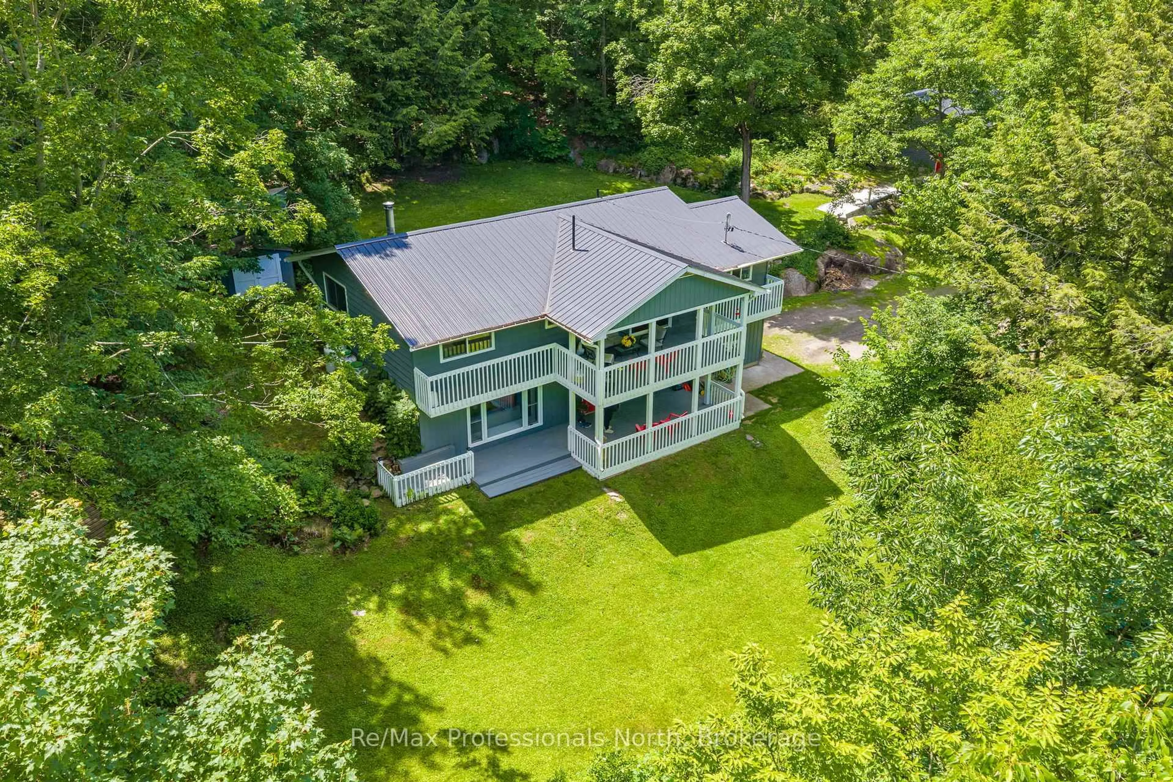 A pic from outside/outdoor area/front of a property/back of a property/a pic from drone, water/lake/river/ocean view for 1032 Bradley Rd, Muskoka Lakes Ontario P1P 1R2