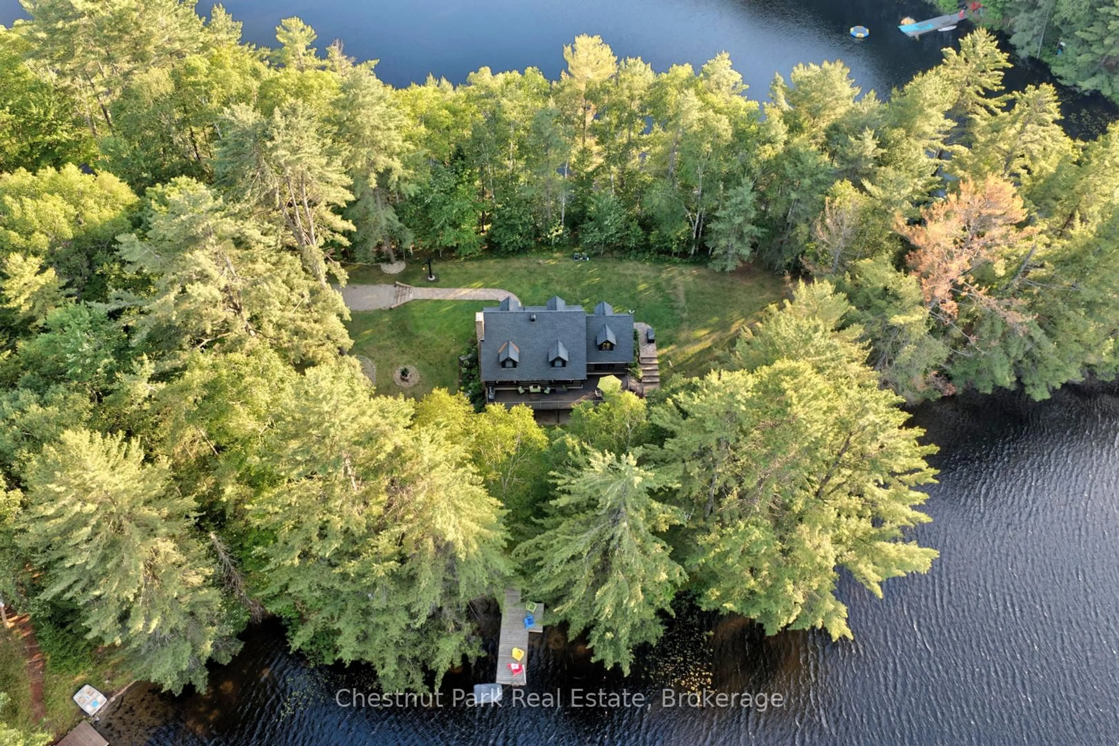 A pic from outside/outdoor area/front of a property/back of a property/a pic from drone, water/lake/river/ocean view for 507 North Waseosa Lake Rd, Huntsville Ontario P1H 2J4