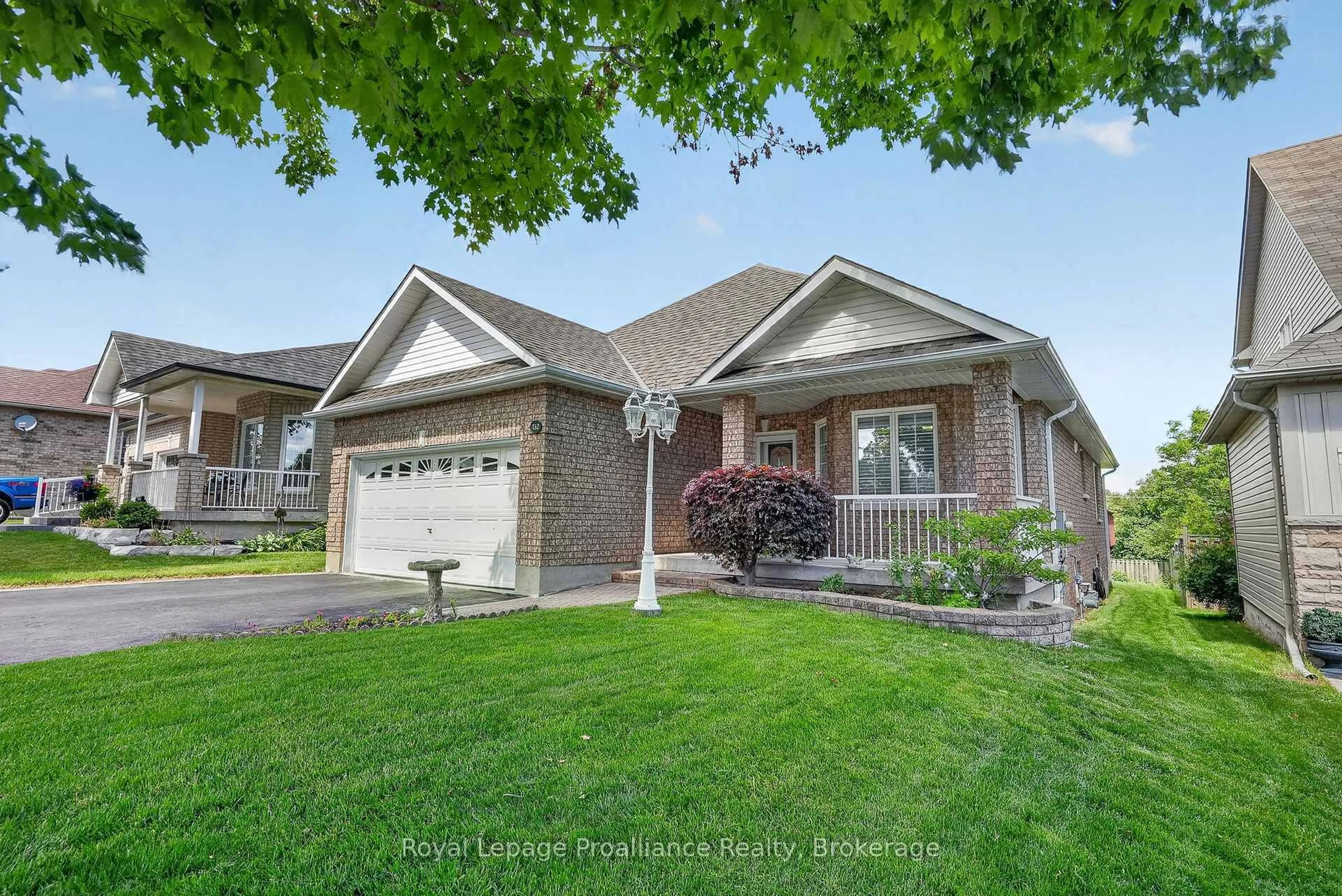 Home with brick exterior material, street for 732 Prince Of Wales Dr, Cobourg Ontario K9A 5X8