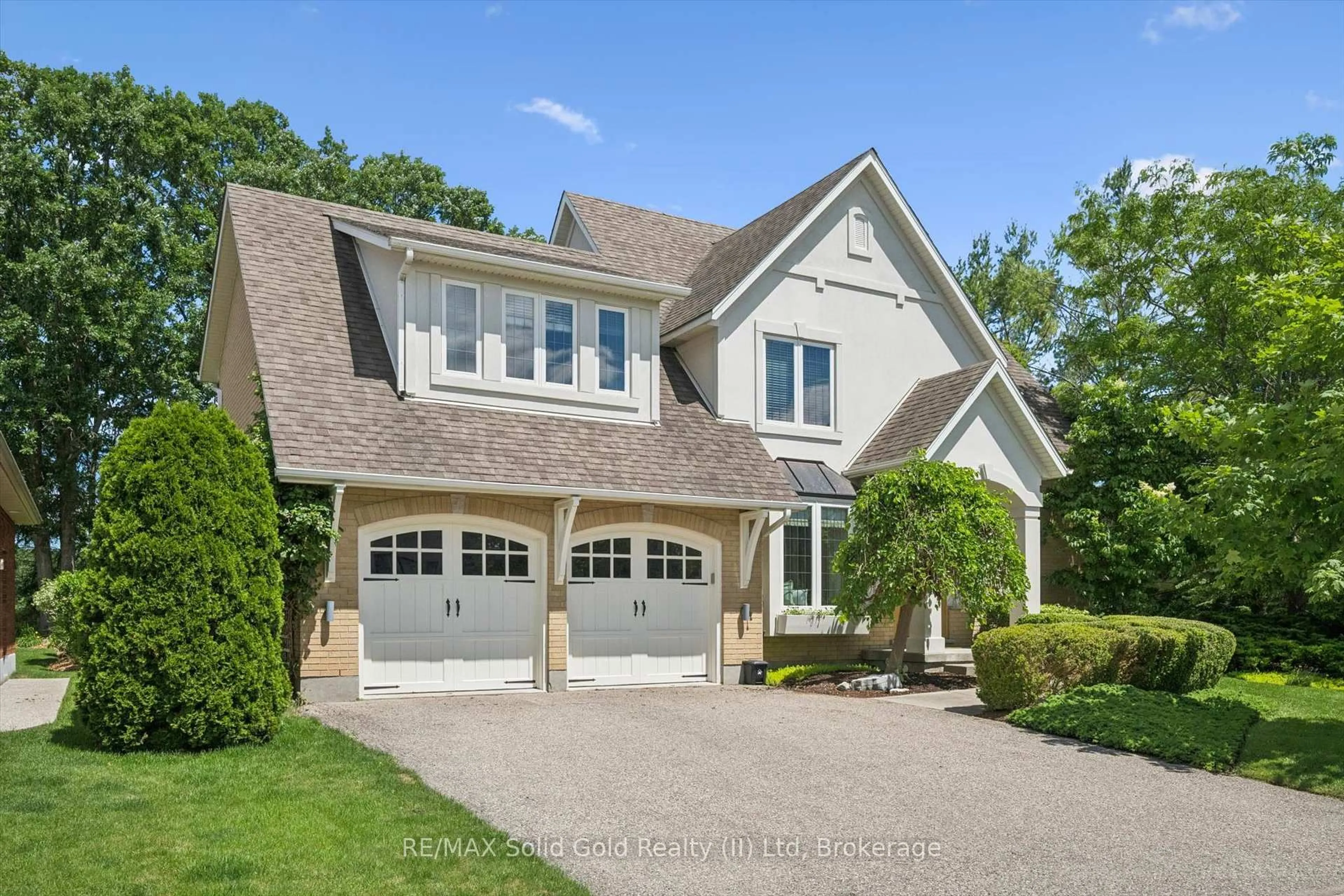 Home with brick exterior material, street for 576 Falconridge Cres, Waterloo Ontario N2K 4J2