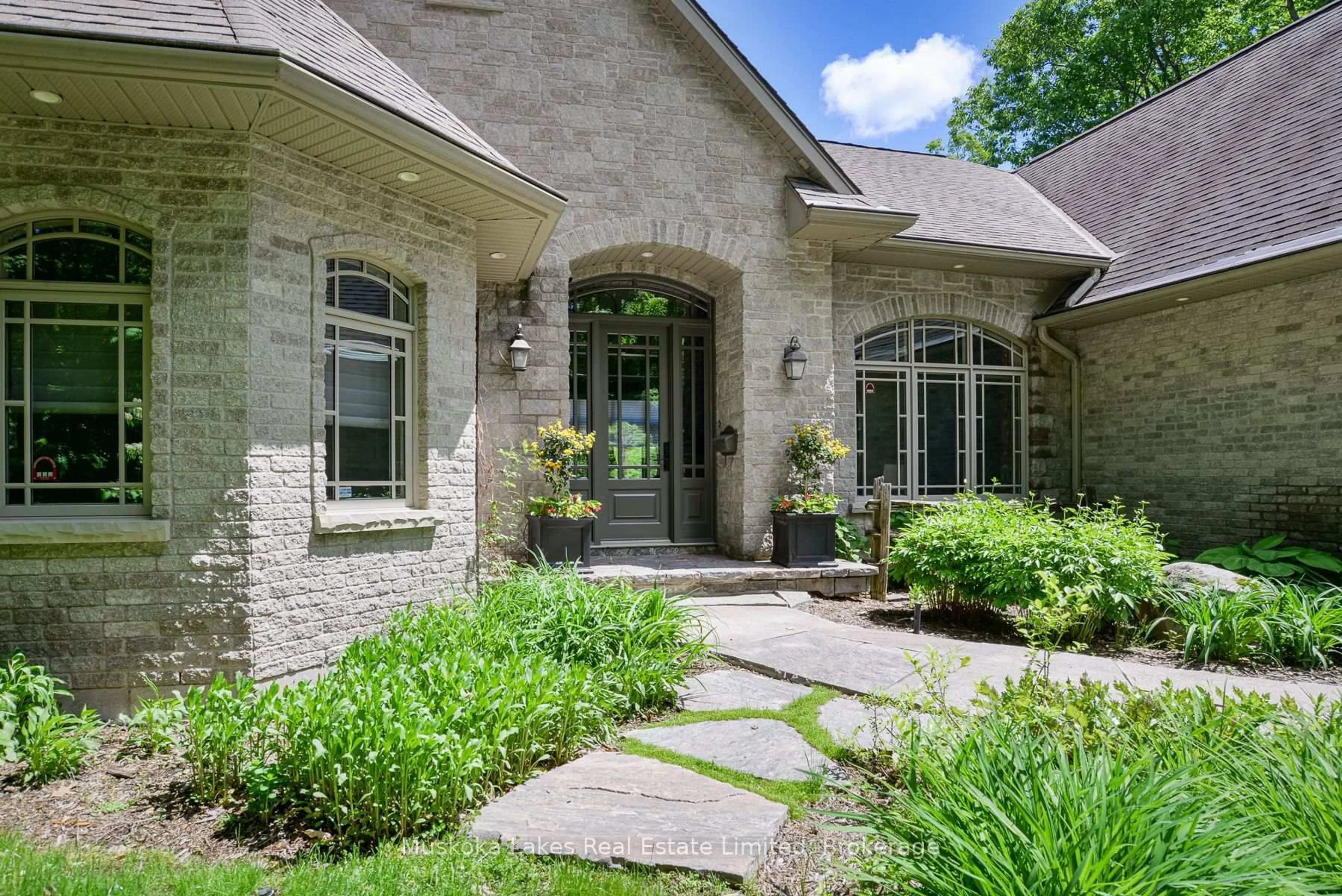 Home with brick exterior material, street for 44 Estate Dr, Muskoka Lakes Ontario P0B 1J0