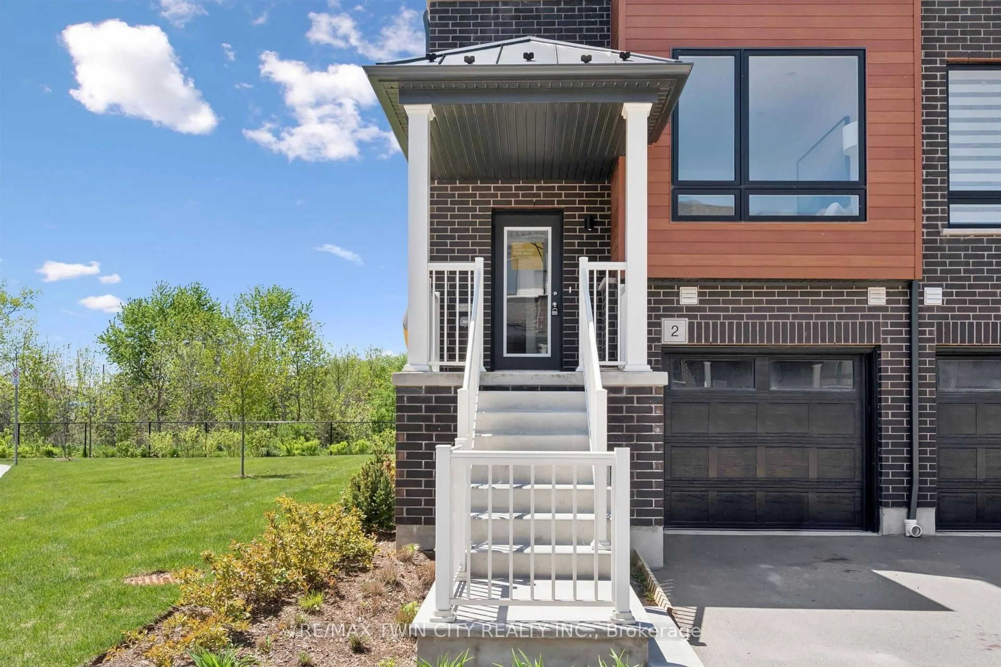 Home with brick exterior material, street for 2 Sora Lane, Guelph Ontario N1E 0T4