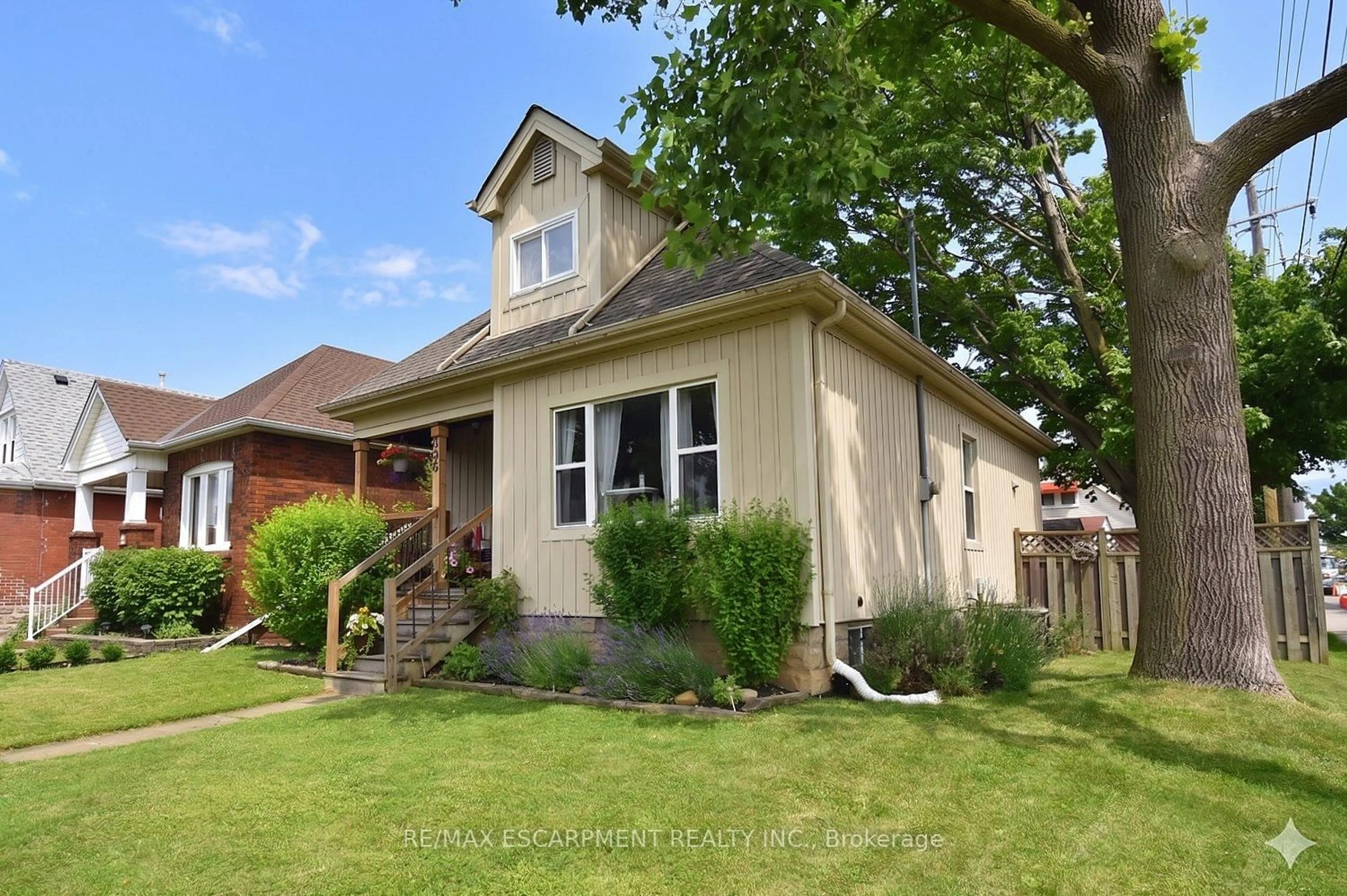 Home with brick exterior material, street for 56 Barons Ave, Hamilton Ontario L8H 5A4