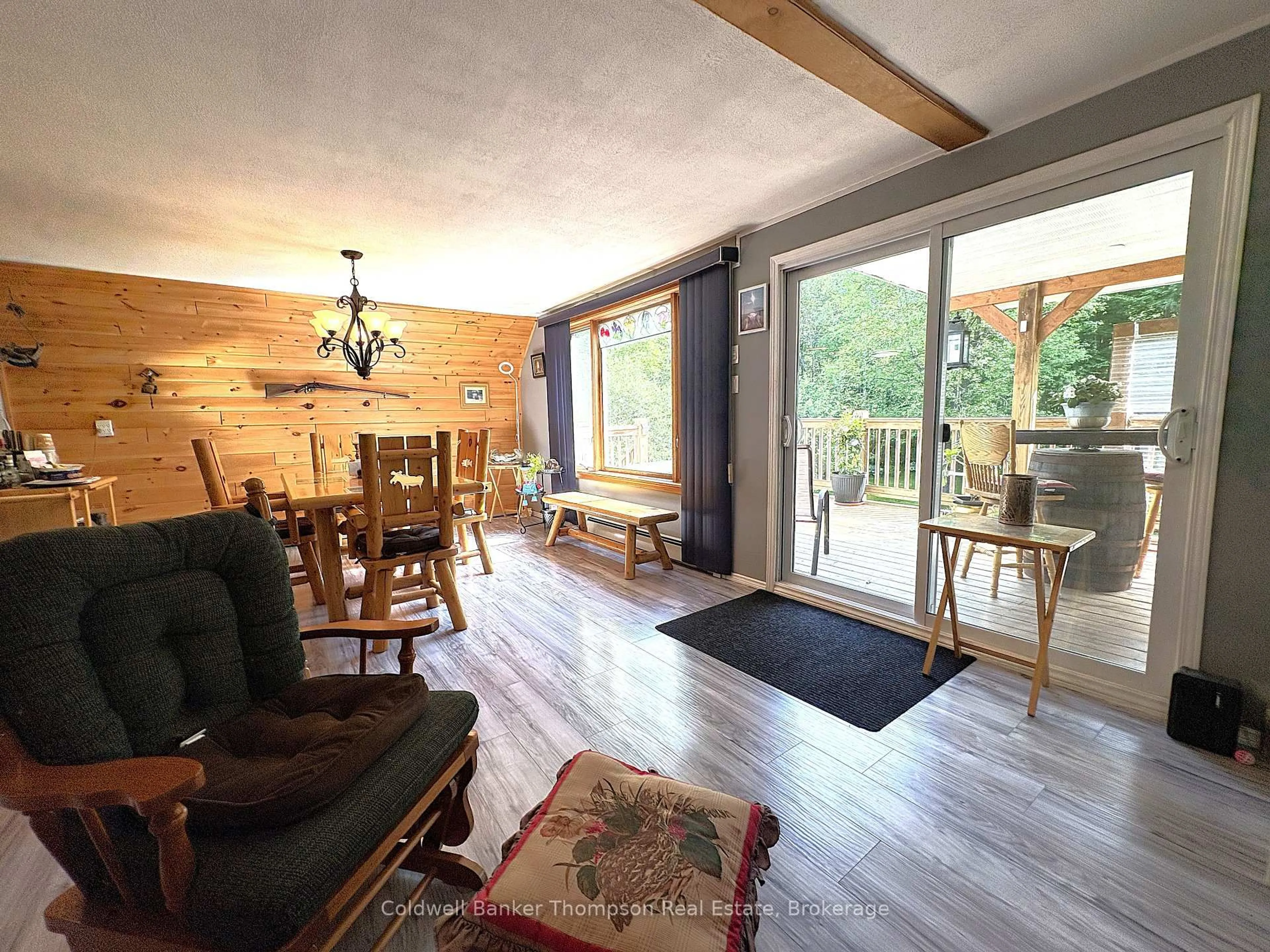 Living room with furniture, wood/laminate floor for 273 Simpson's Hill Rd, Machar Ontario P0A 1X0