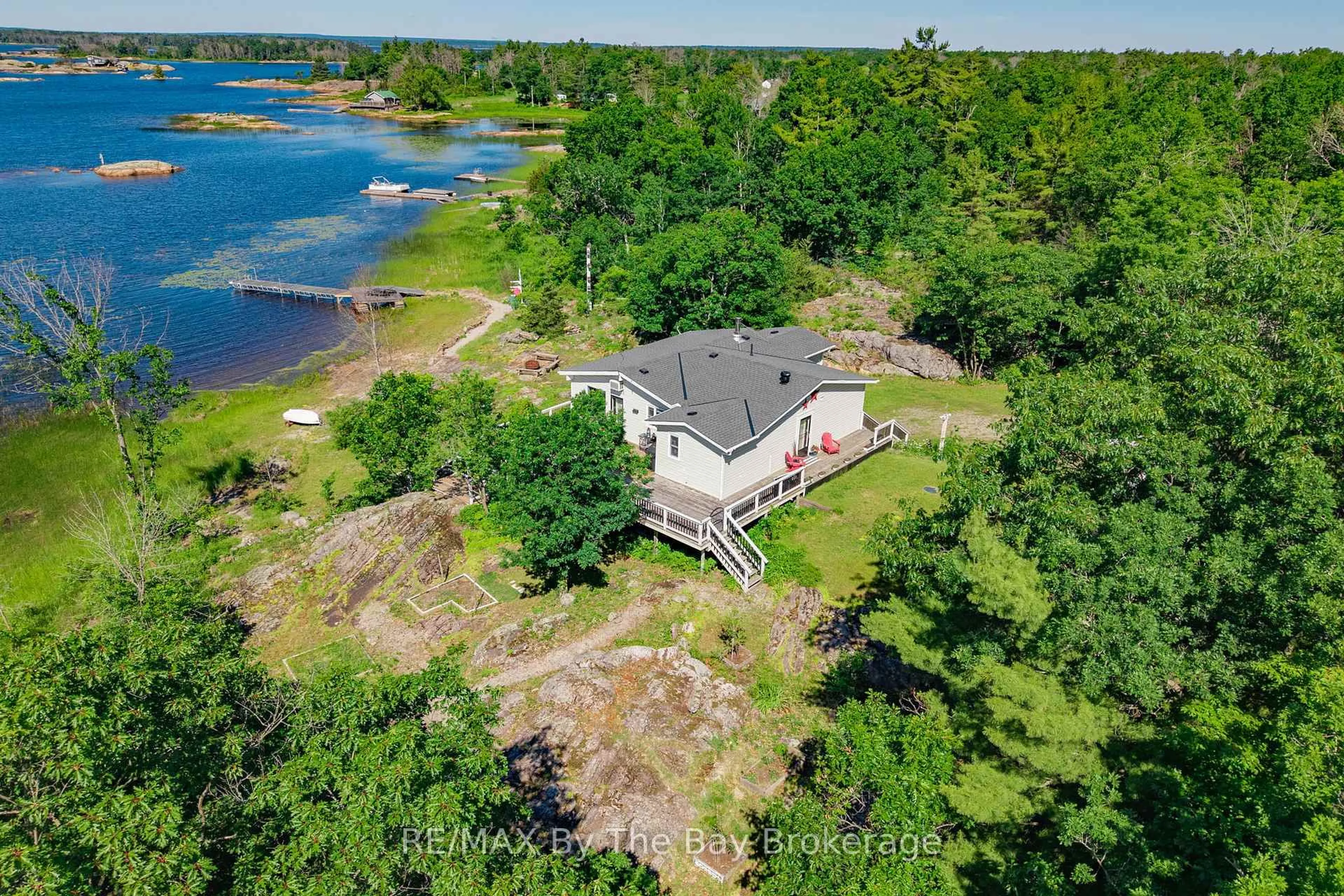A pic from outside/outdoor area/front of a property/back of a property/a pic from drone, water/lake/river/ocean view for 151 Macey Bay Rd, Georgian Bay Ontario L0K 1S0