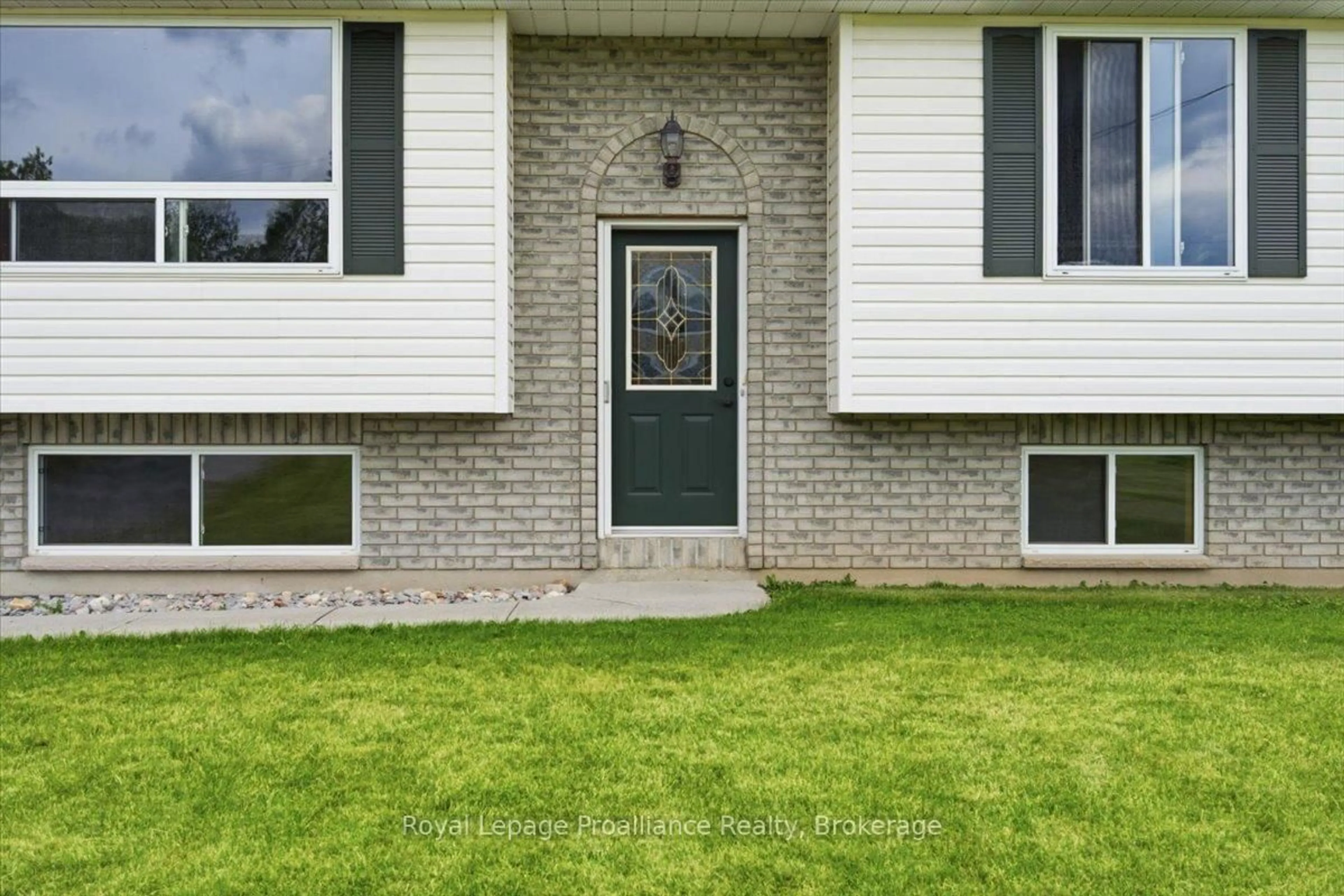 Home with vinyl exterior material, street for 1005 Victoria Rd, Prince Edward County Ontario K0K 1A0