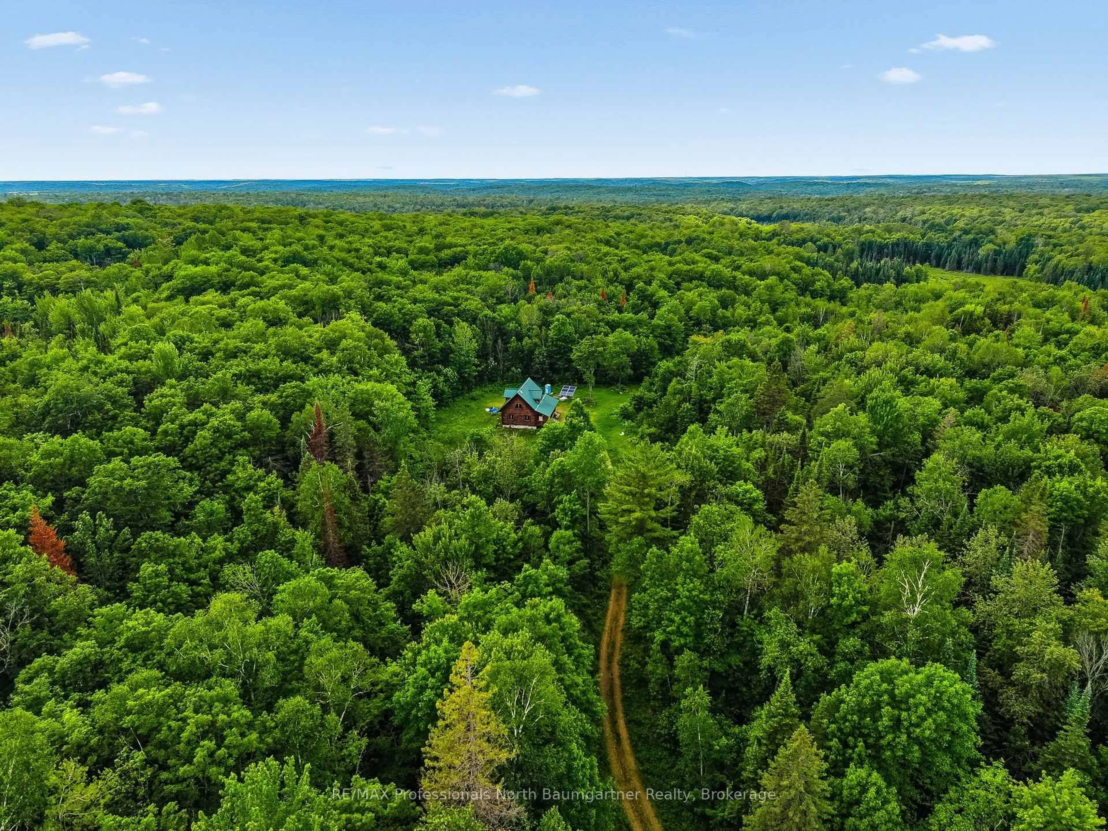 A pic from outside/outdoor area/front of a property/back of a property/a pic from drone, forest/trees view for 1230 McCrea Rd, Highlands East Ontario K0L 2Y0