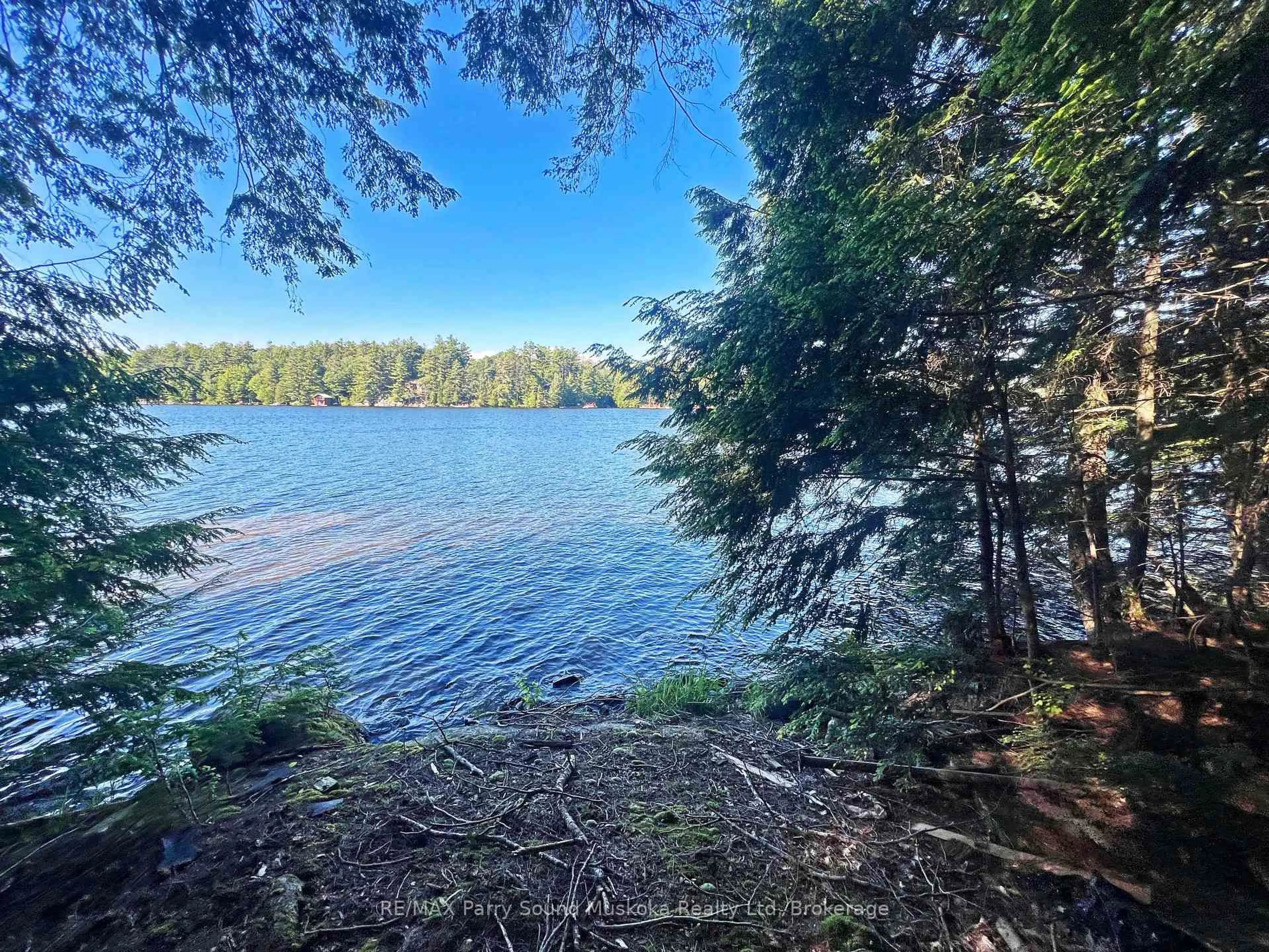 A pic from outside/outdoor area/front of a property/back of a property/a pic from drone, water/lake/river/ocean view for 15 Schmidt Circ, Seguin Ontario P2A 0B2