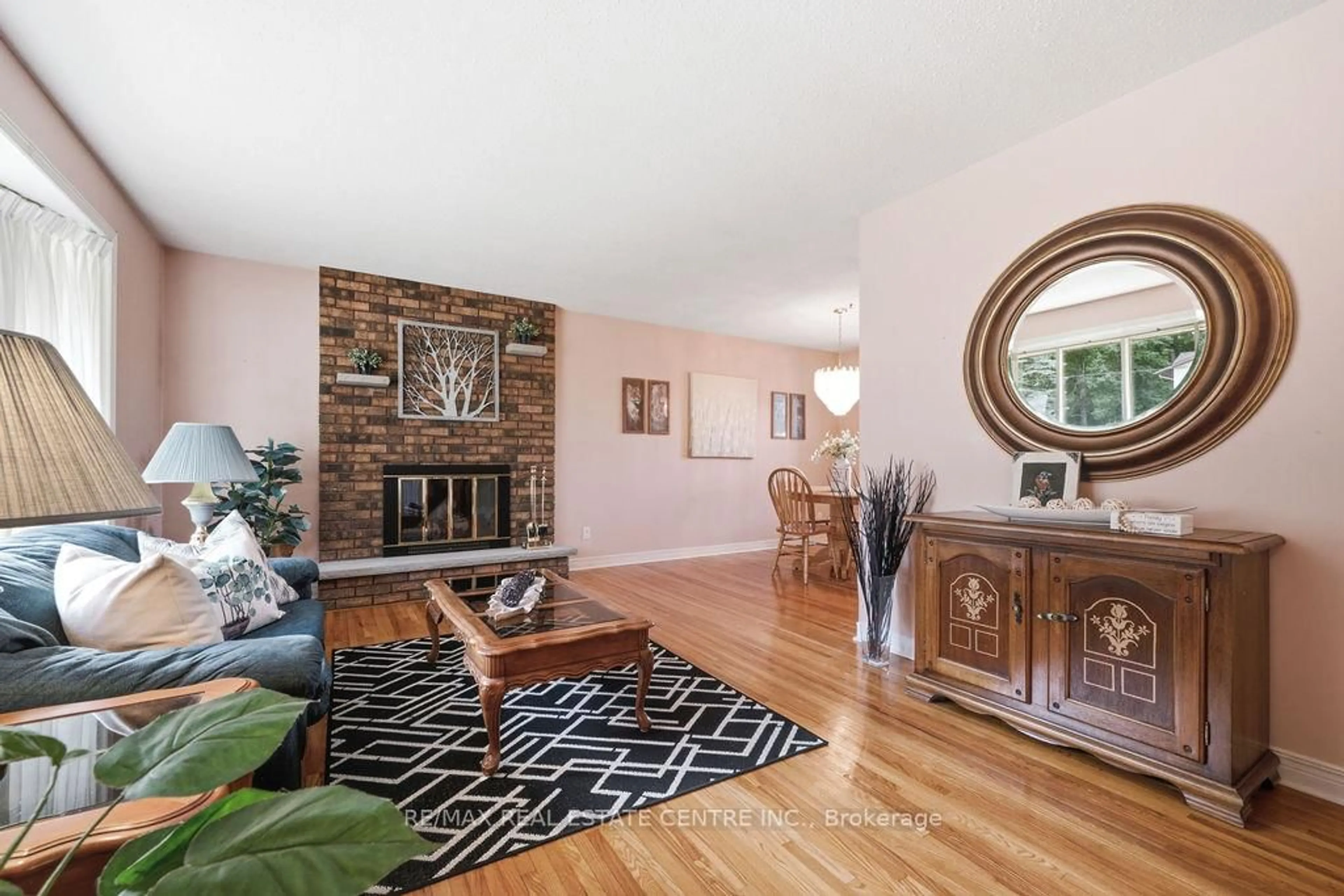 Living room with furniture, wood/laminate floor for 633 Birch St, Petawawa Ontario K8A 7K7