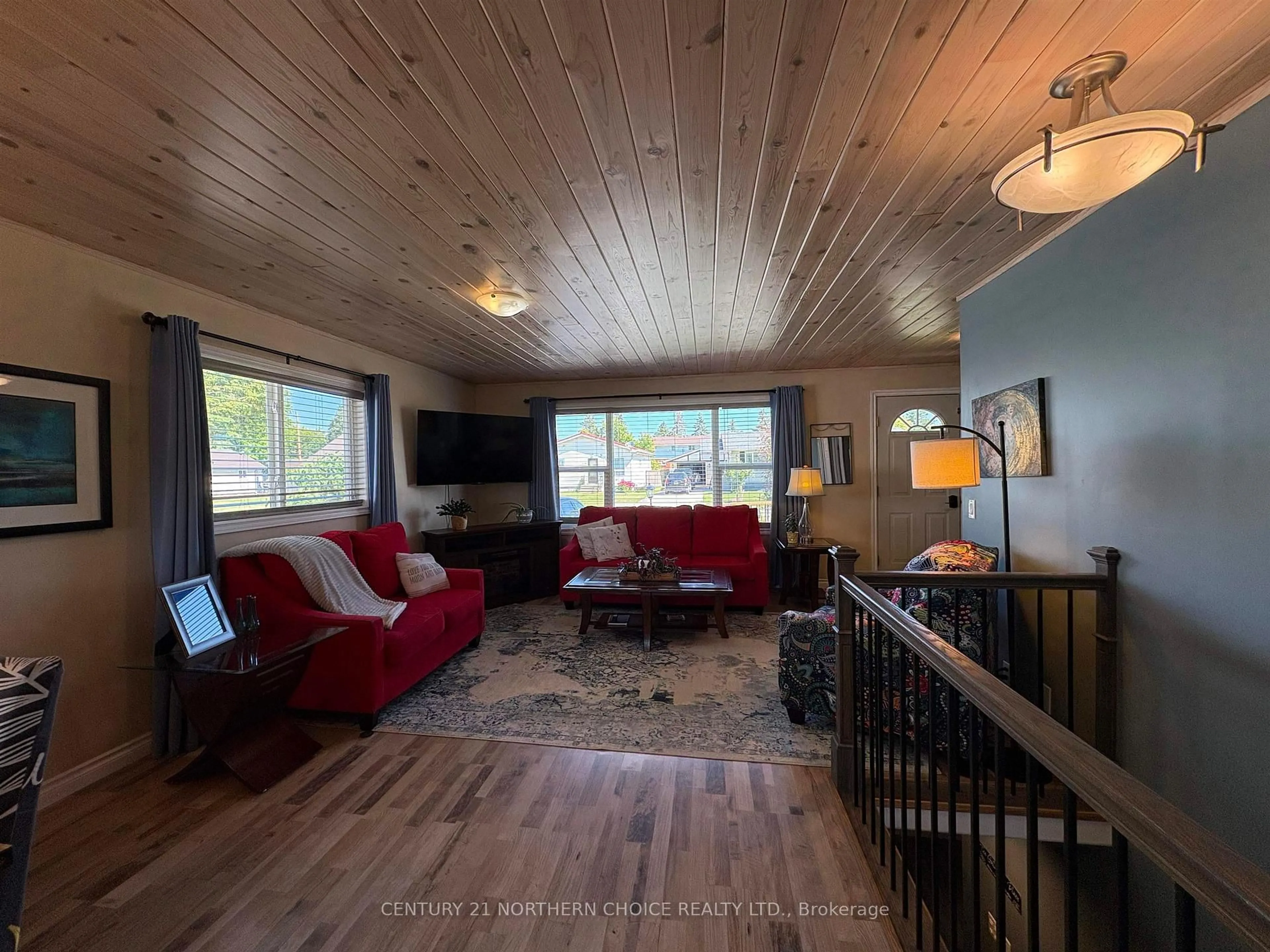 Living room with furniture, wood/laminate floor for 1119 Third St, Fort Frances Ontario P9A 1S6