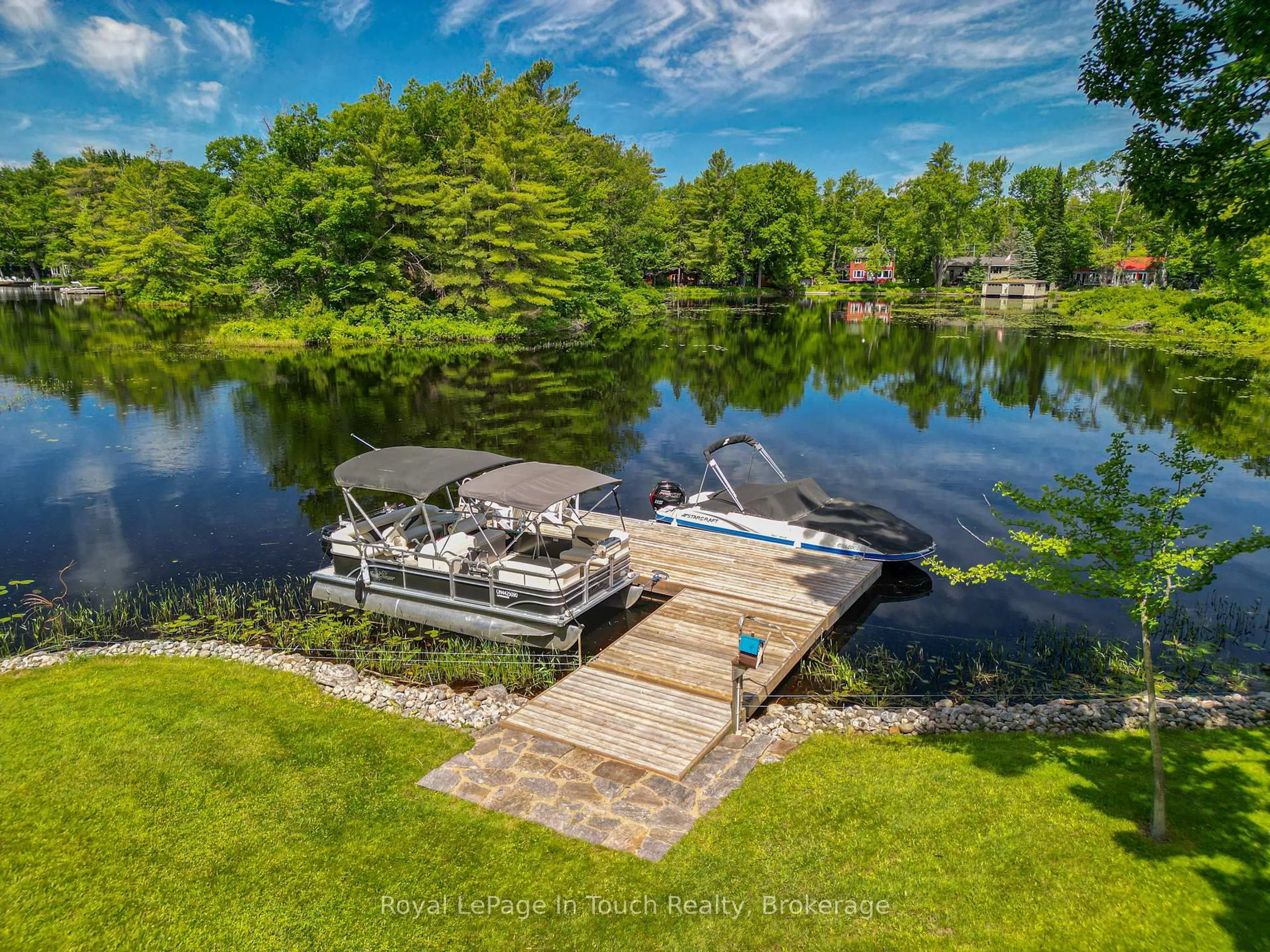 A pic from outside/outdoor area/front of a property/back of a property/a pic from drone, water/lake/river/ocean view for 1464 Golden Beach Rd, Bracebridge Ontario P1L 1W8