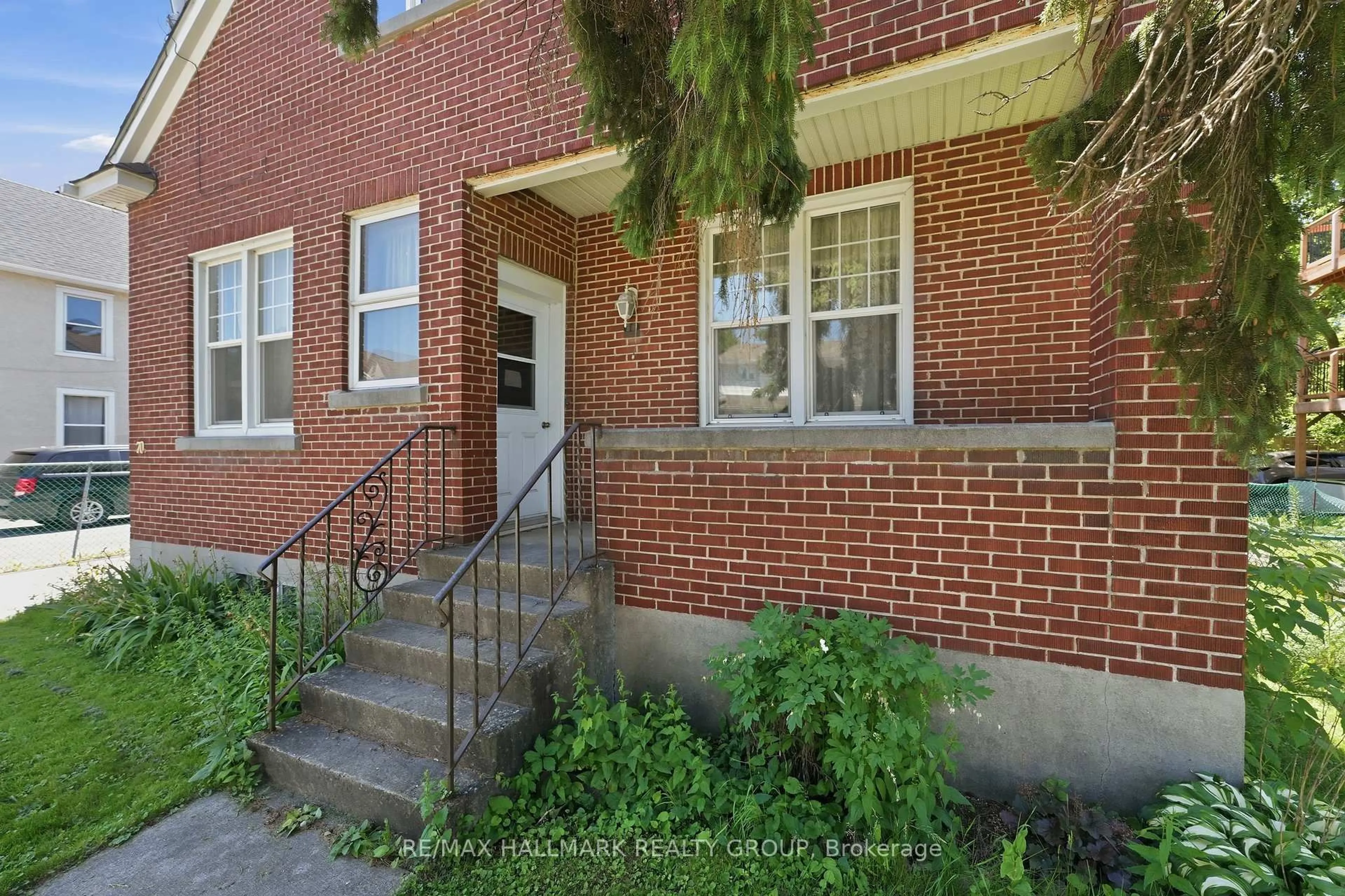 Home with brick exterior material, street for 70 Queen Mary St, Ottawa Ontario K1K 1X7