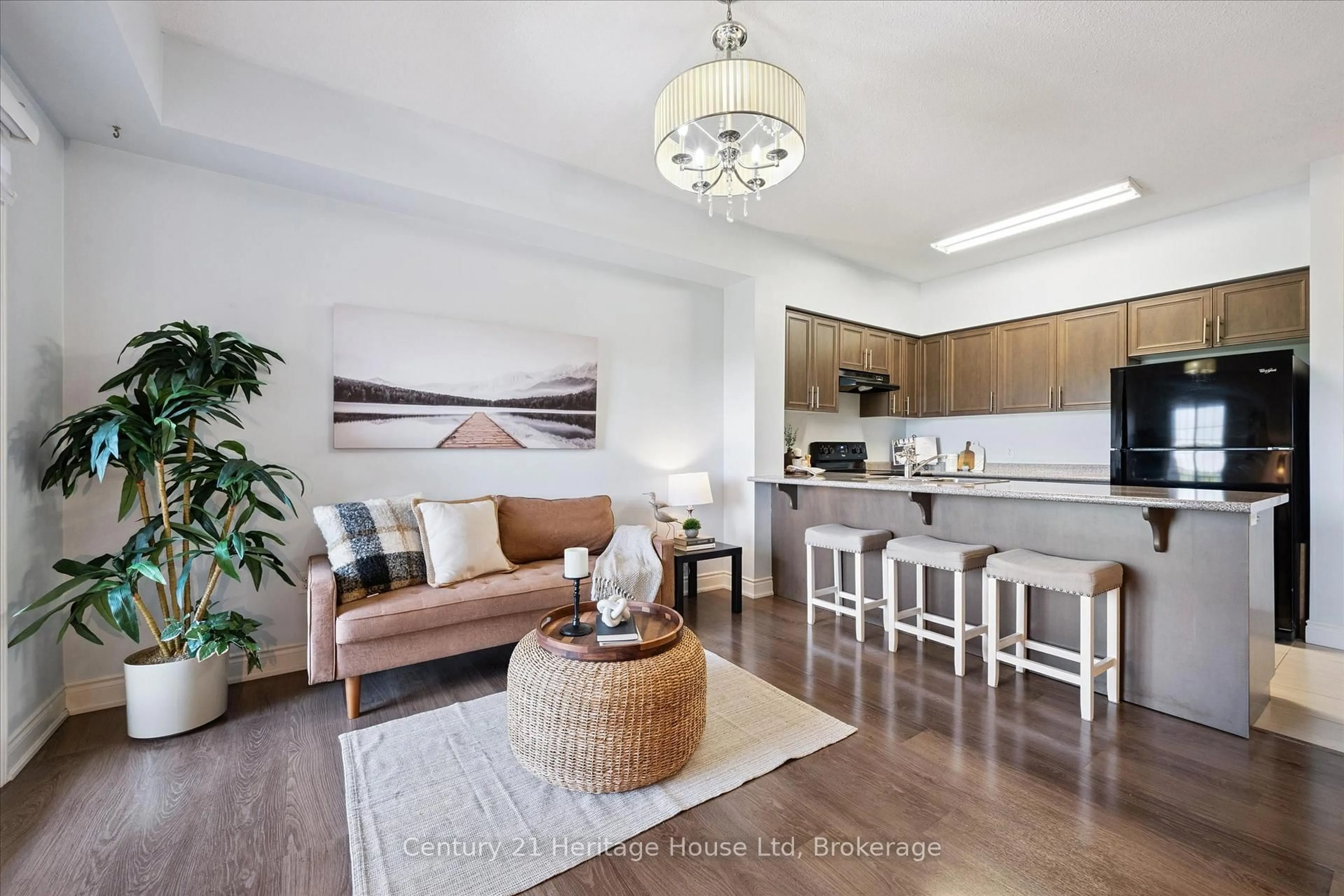 Living room with furniture, wood/laminate floor for 1440 Gordon St #404, Guelph Ontario N1L 1C8