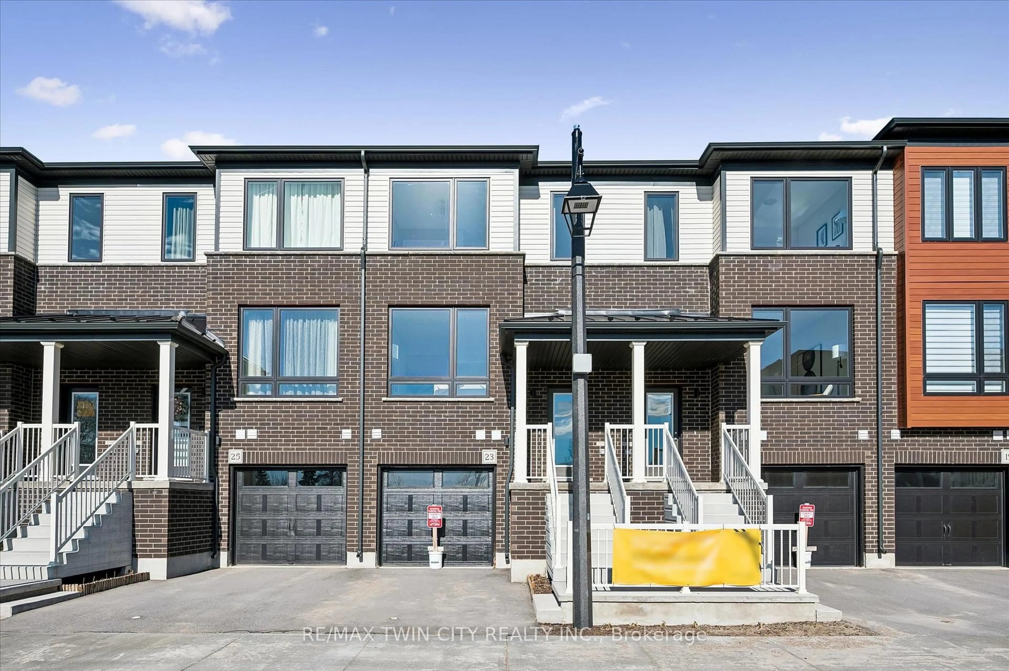 Home with brick exterior material, street for 23 Sora Lane, Guelph Ontario N1E 0T4