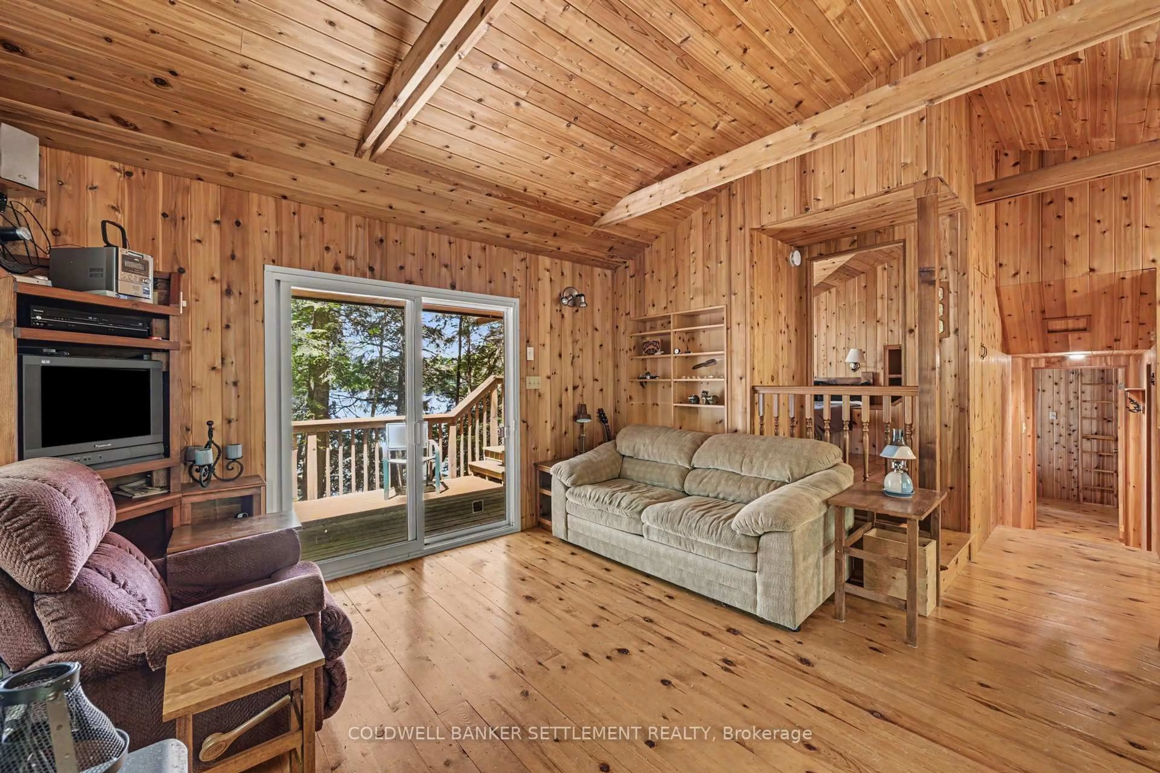 Living room with furniture, wood/laminate floor for 6773 Sand Island Island, Rideau Lakes Ontario K0G 1V0