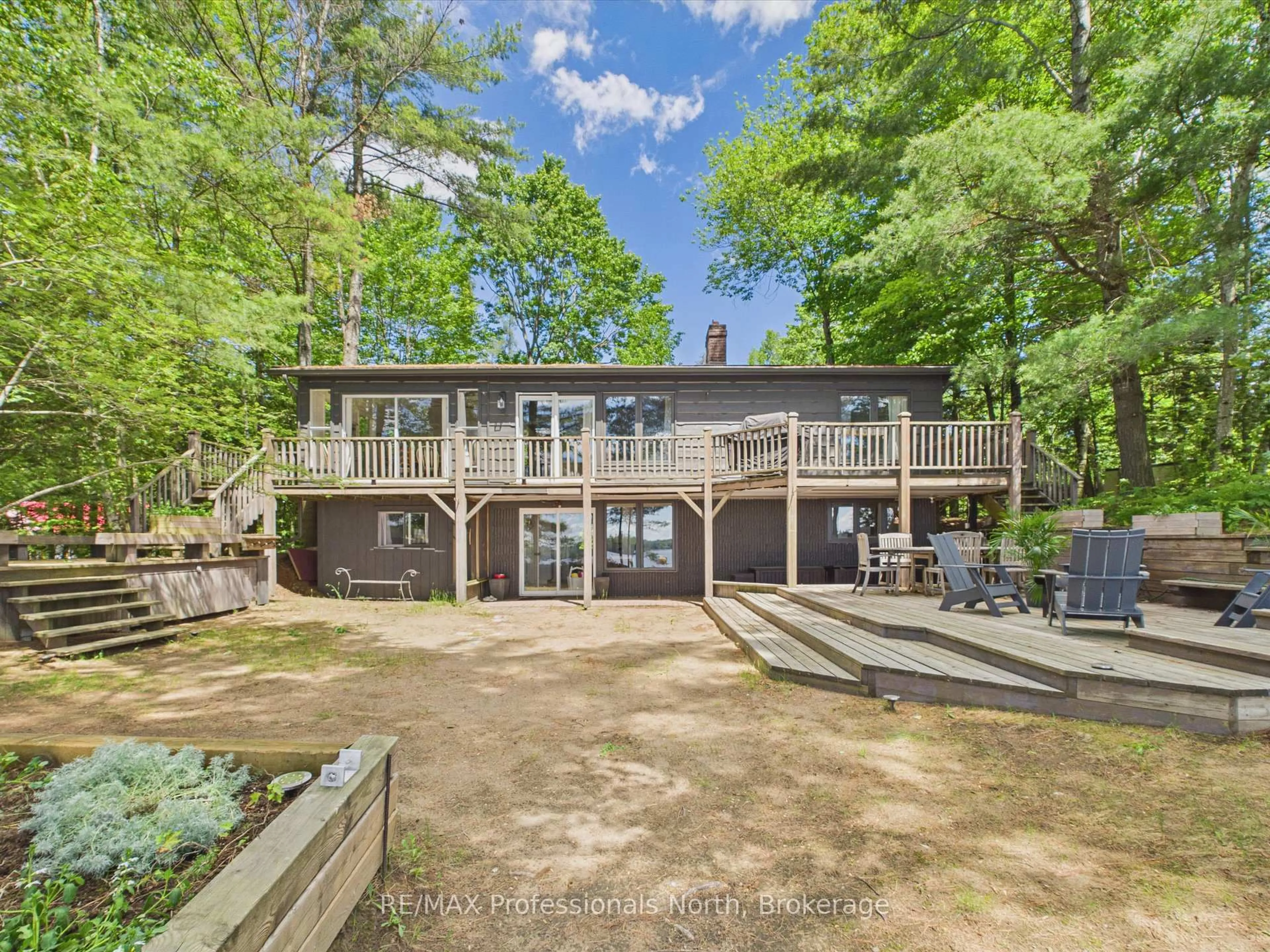 A pic from outside/outdoor area/front of a property/back of a property/a pic from drone, water/lake/river/ocean view for 1398 Milne Rd, Bracebridge Ontario P1L 1X1