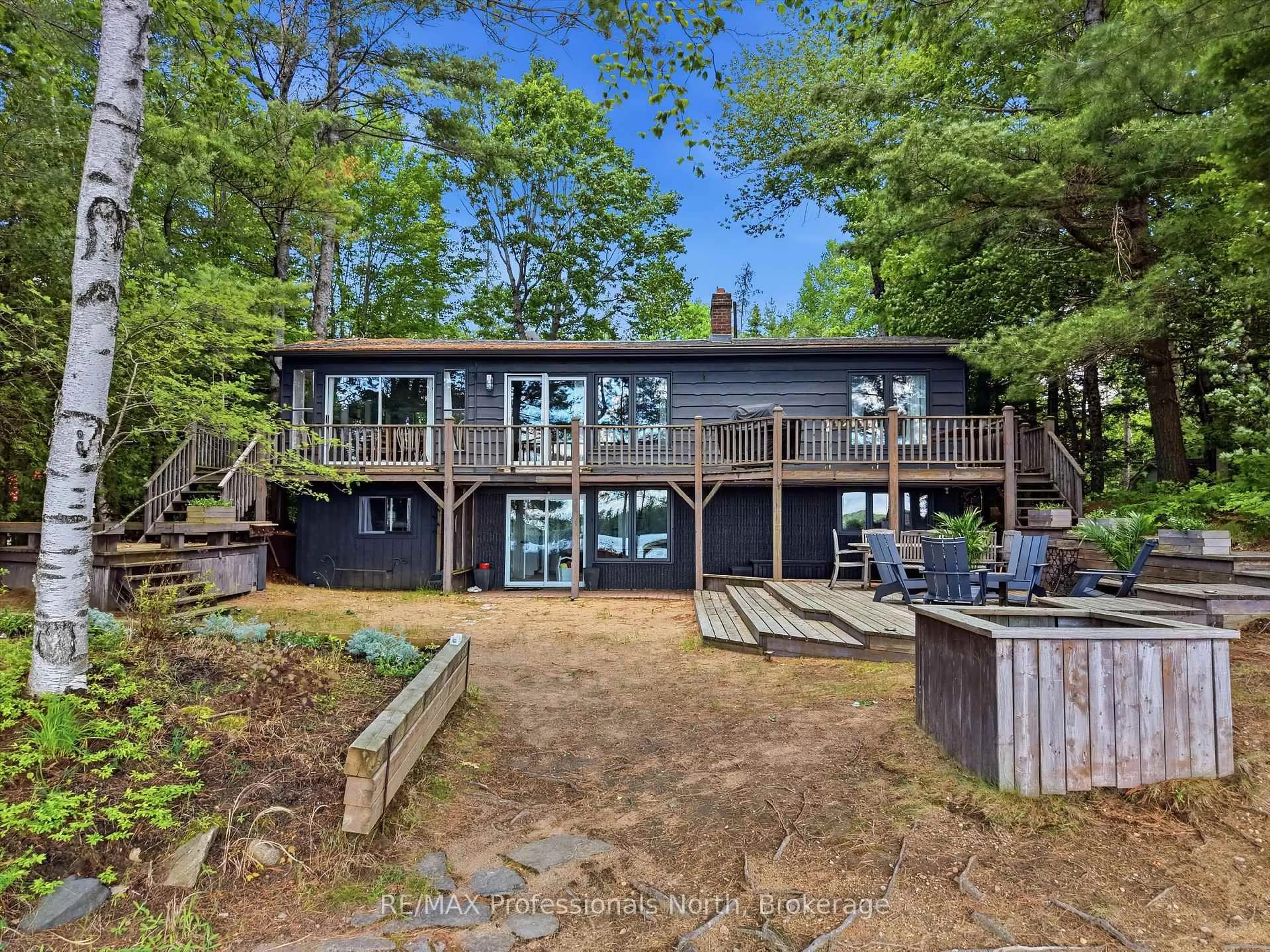 A pic from outside/outdoor area/front of a property/back of a property/a pic from drone, water/lake/river/ocean view for 1398 Milne Rd, Bracebridge Ontario P1L 1X1