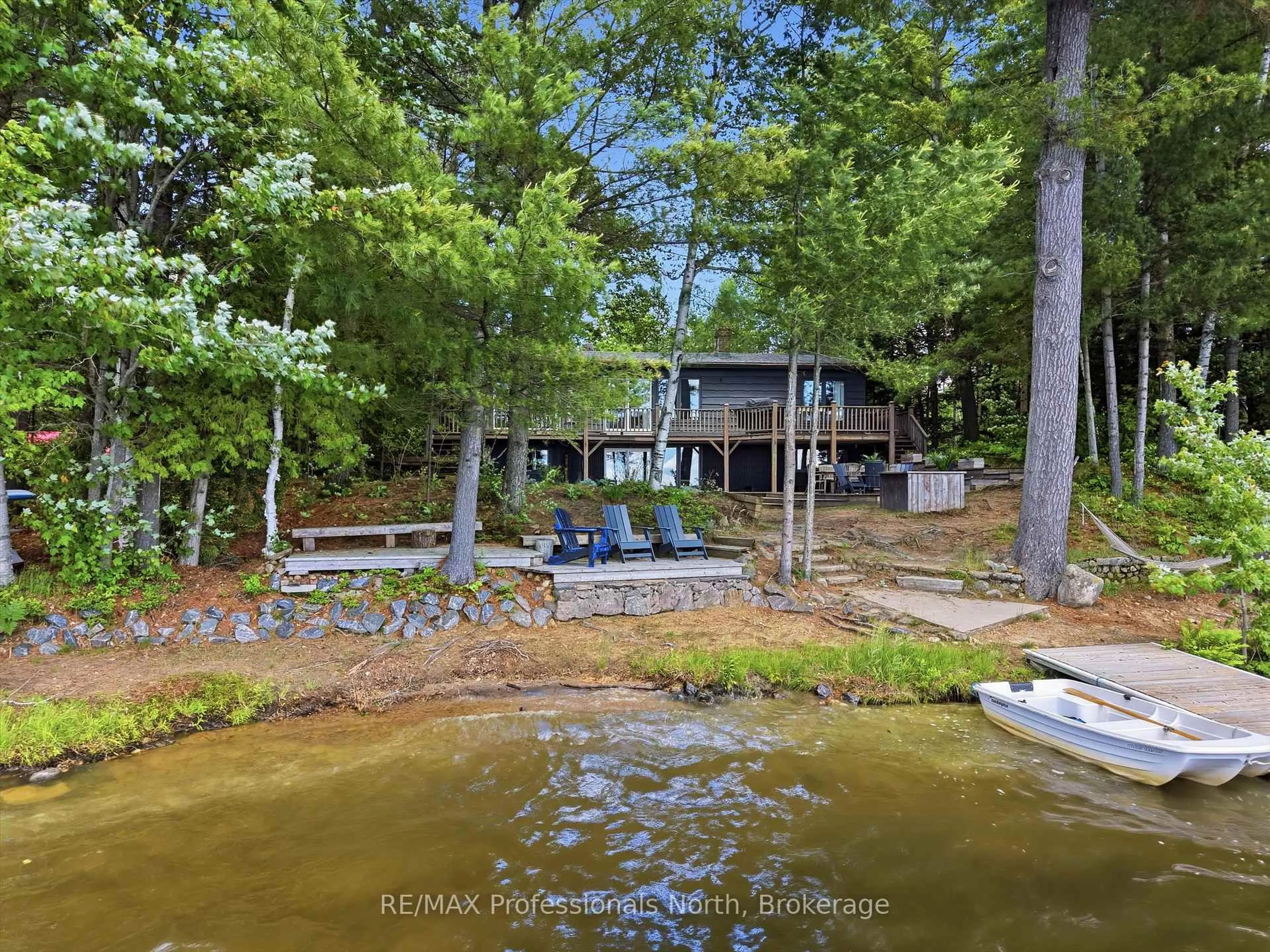 A pic from outside/outdoor area/front of a property/back of a property/a pic from drone, water/lake/river/ocean view for 1398 Milne Rd, Bracebridge Ontario P1L 1X1