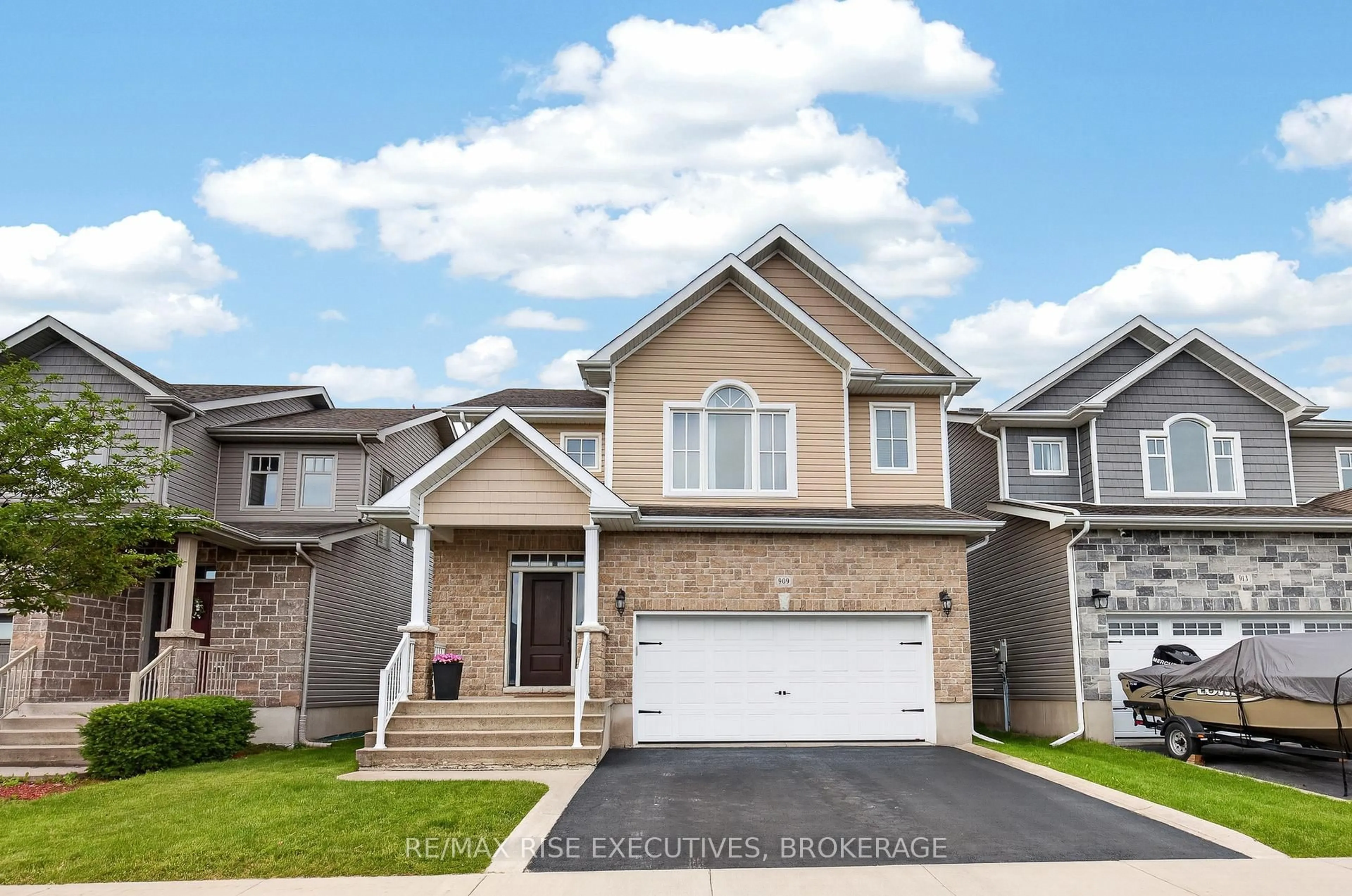 Home with brick exterior material, street for 909 Edward Riley Dr, Kingston Ontario K7P 0E3