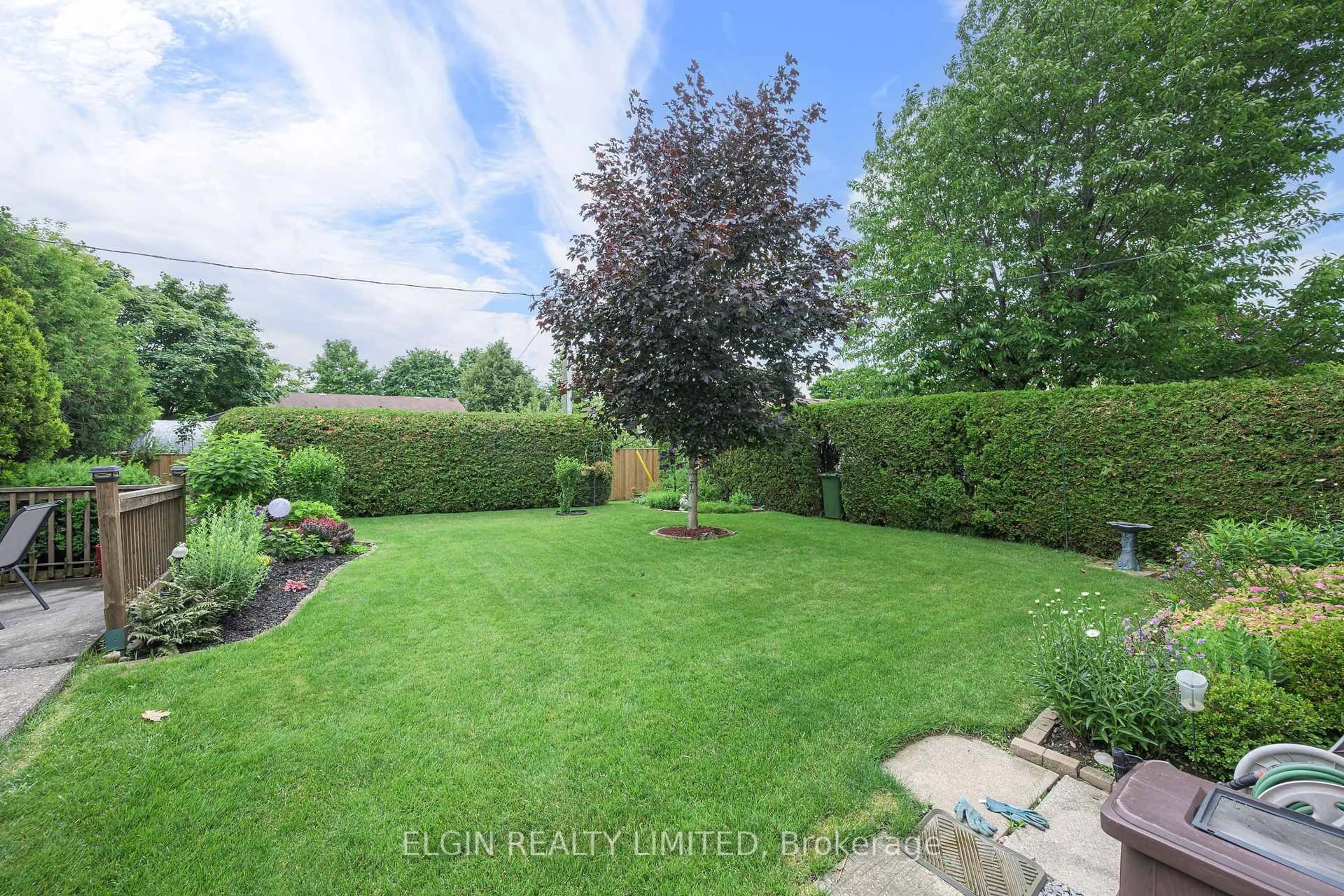 A pic from outside/outdoor area/front of a property/back of a property/a pic from drone, forest/trees view for 14 Raven Ave, St. Thomas Ontario N5R 5L1
