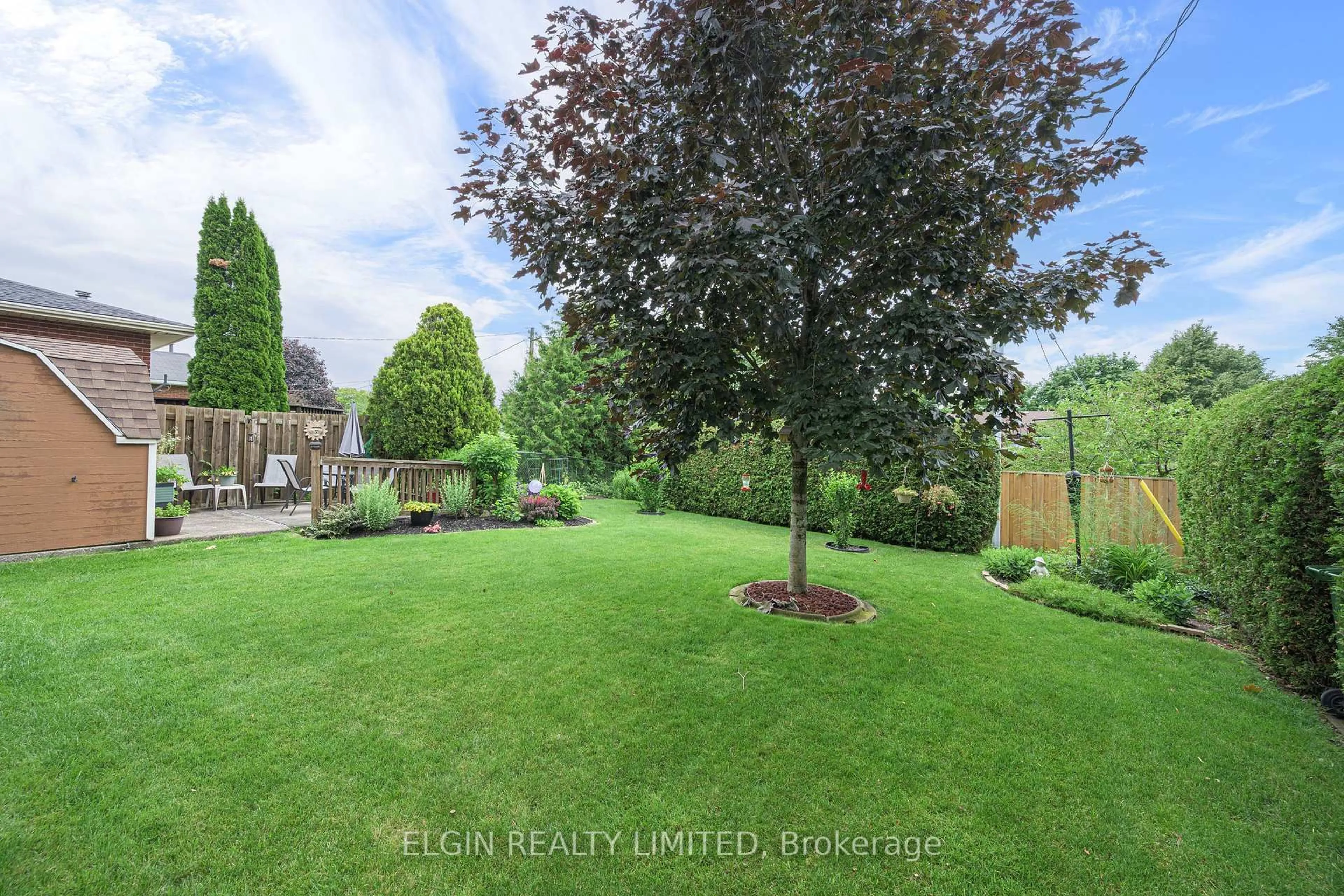 A pic from outside/outdoor area/front of a property/back of a property/a pic from drone, forest/trees view for 14 Raven Ave, St. Thomas Ontario N5R 5L1
