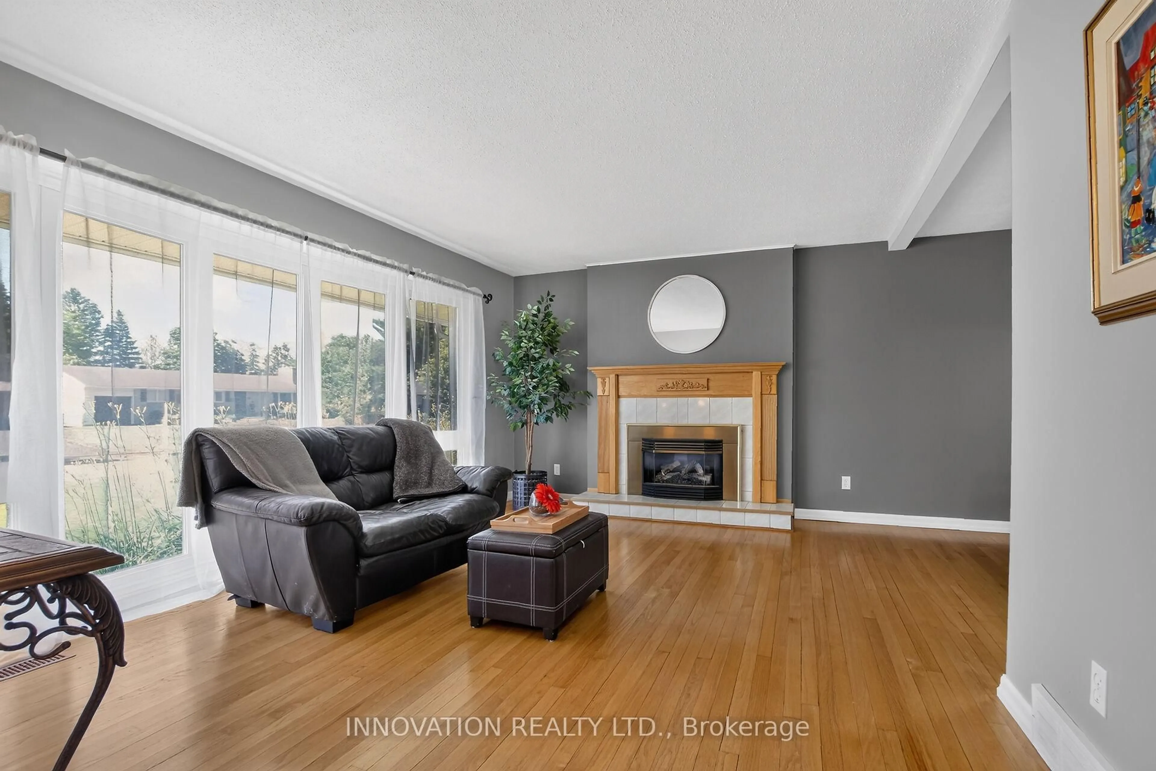 Living room with furniture, wood/laminate floor for 13 Dorland Cres, Ottawa Ontario K2H 6E6