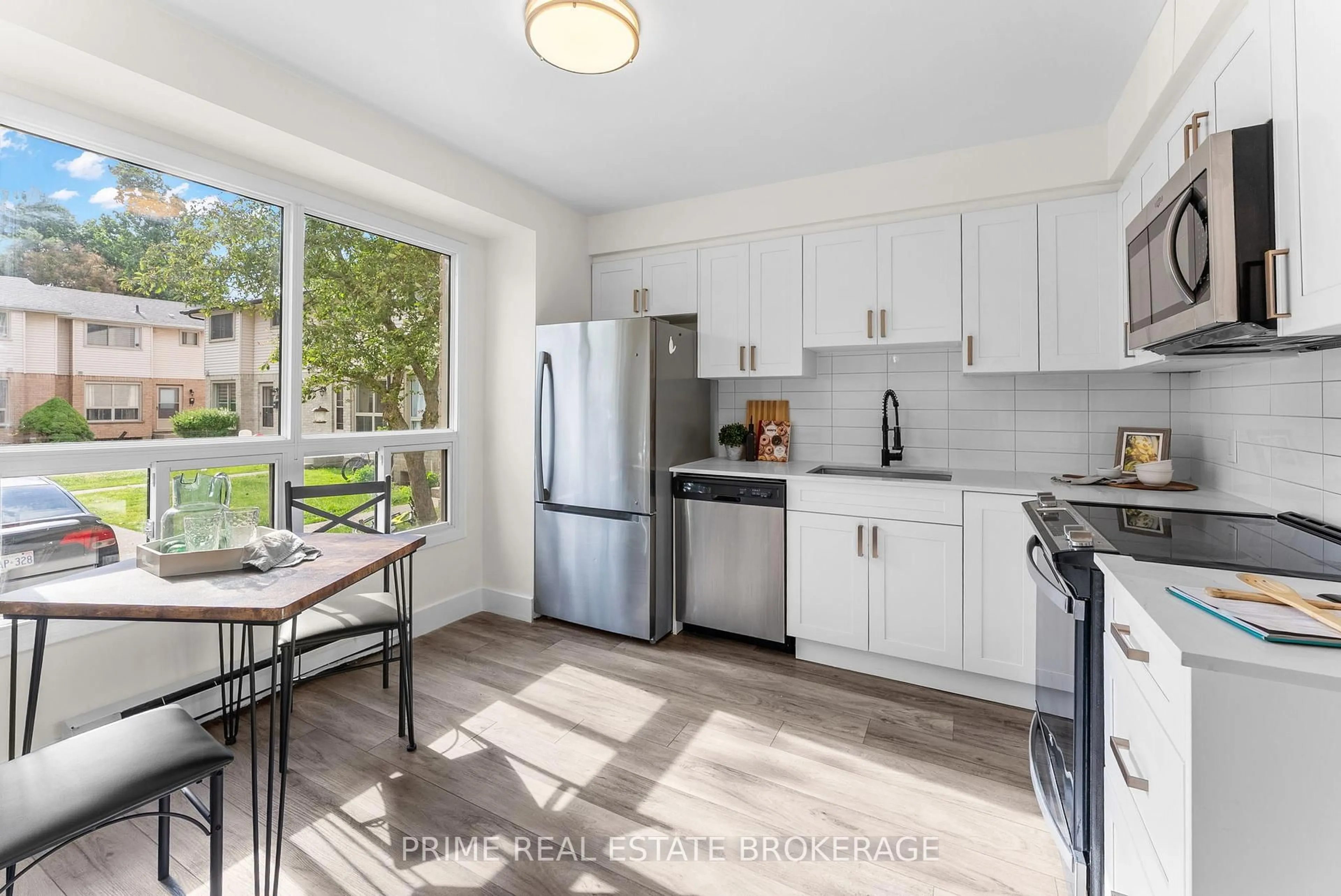 Open concept kitchen, ceramic/tile floor for 678 Upper Queen St #51, London South Ontario N6C 5L2