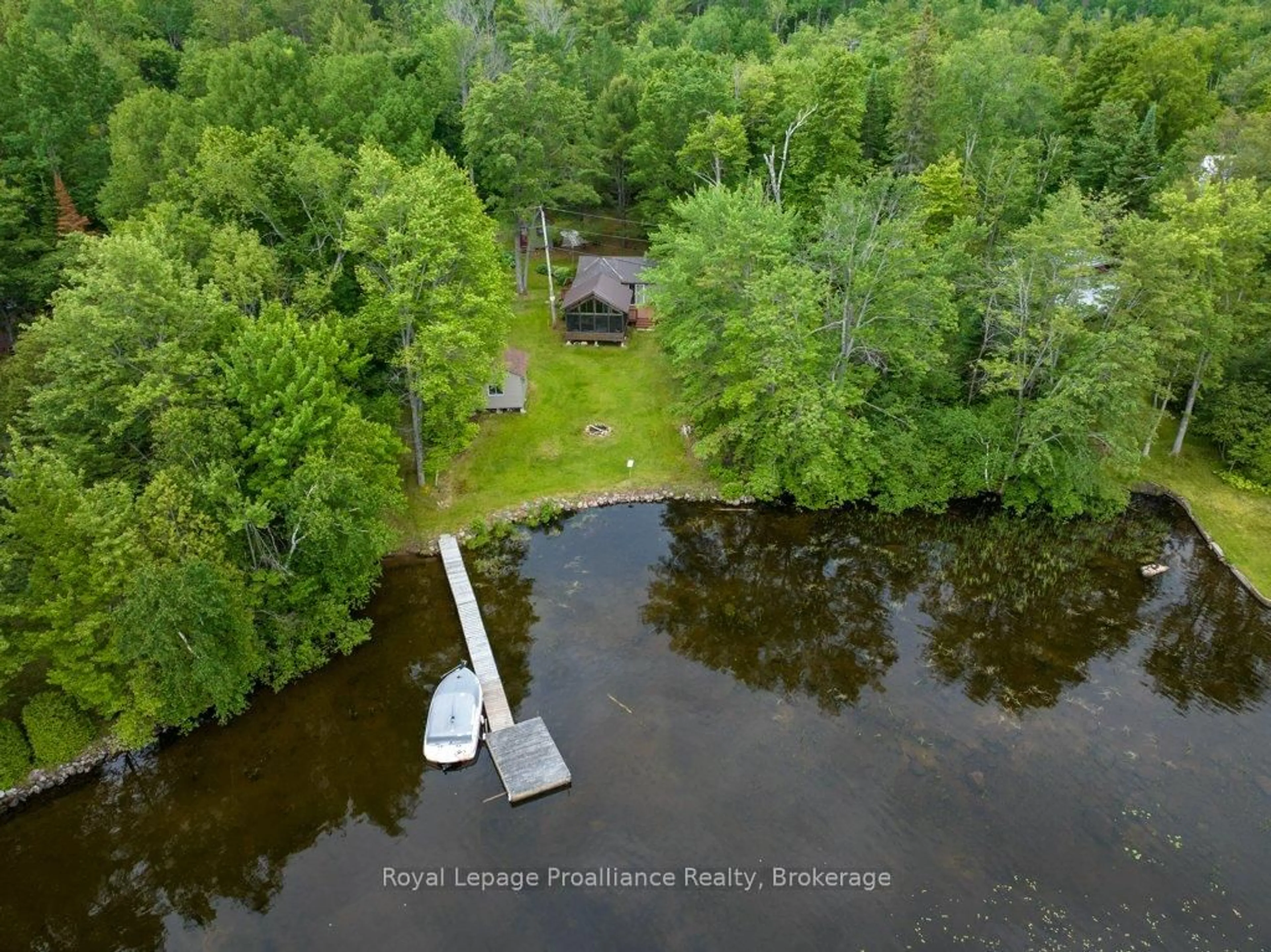 A pic from outside/outdoor area/front of a property/back of a property/a pic from drone, water/lake/river/ocean view for 1161 Hughes Landing Rd, Cloyne Ontario K0H 1K0
