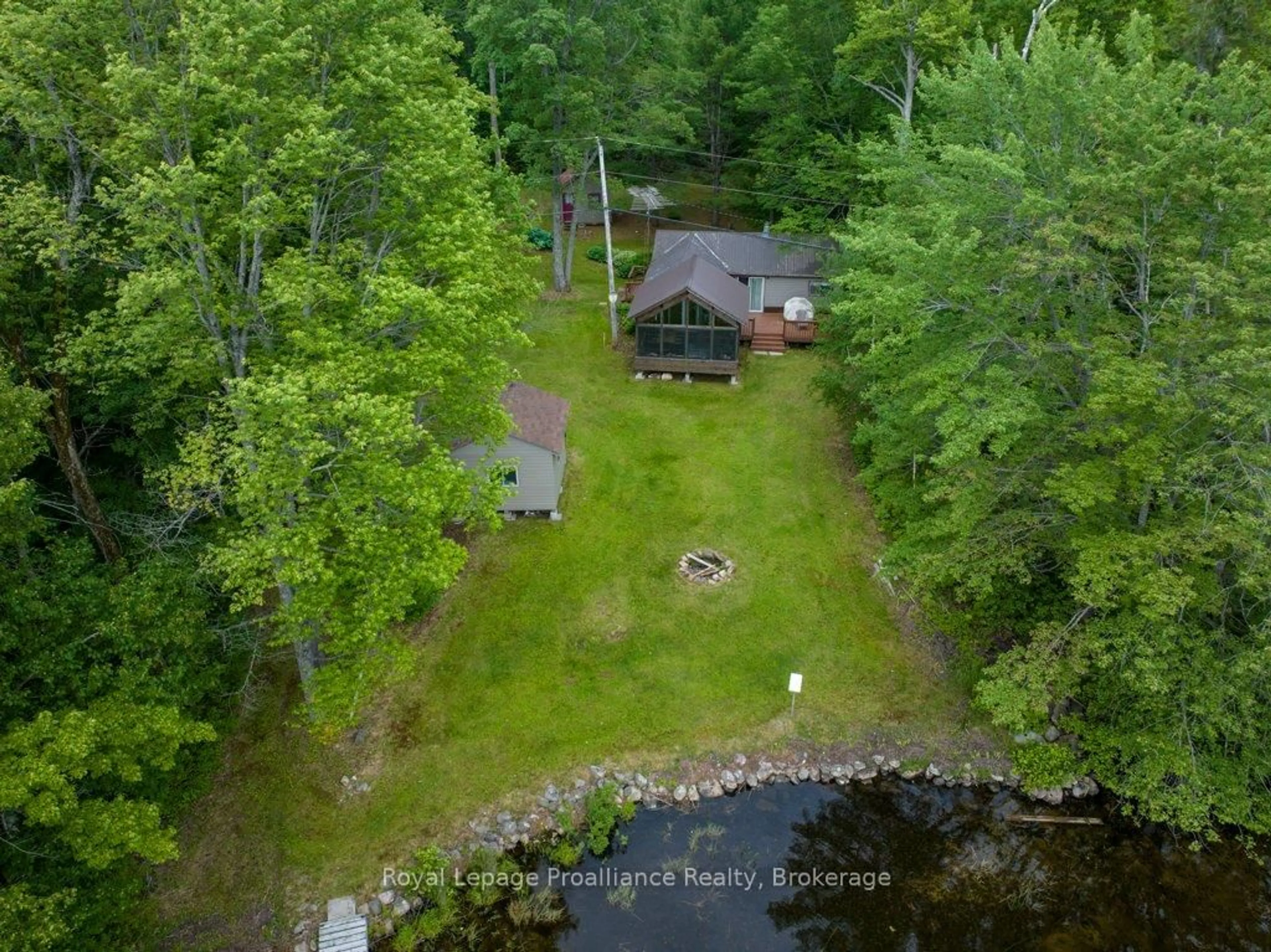 A pic from outside/outdoor area/front of a property/back of a property/a pic from drone, water/lake/river/ocean view for 1161 Hughes Landing Rd, Cloyne Ontario K0H 1K0
