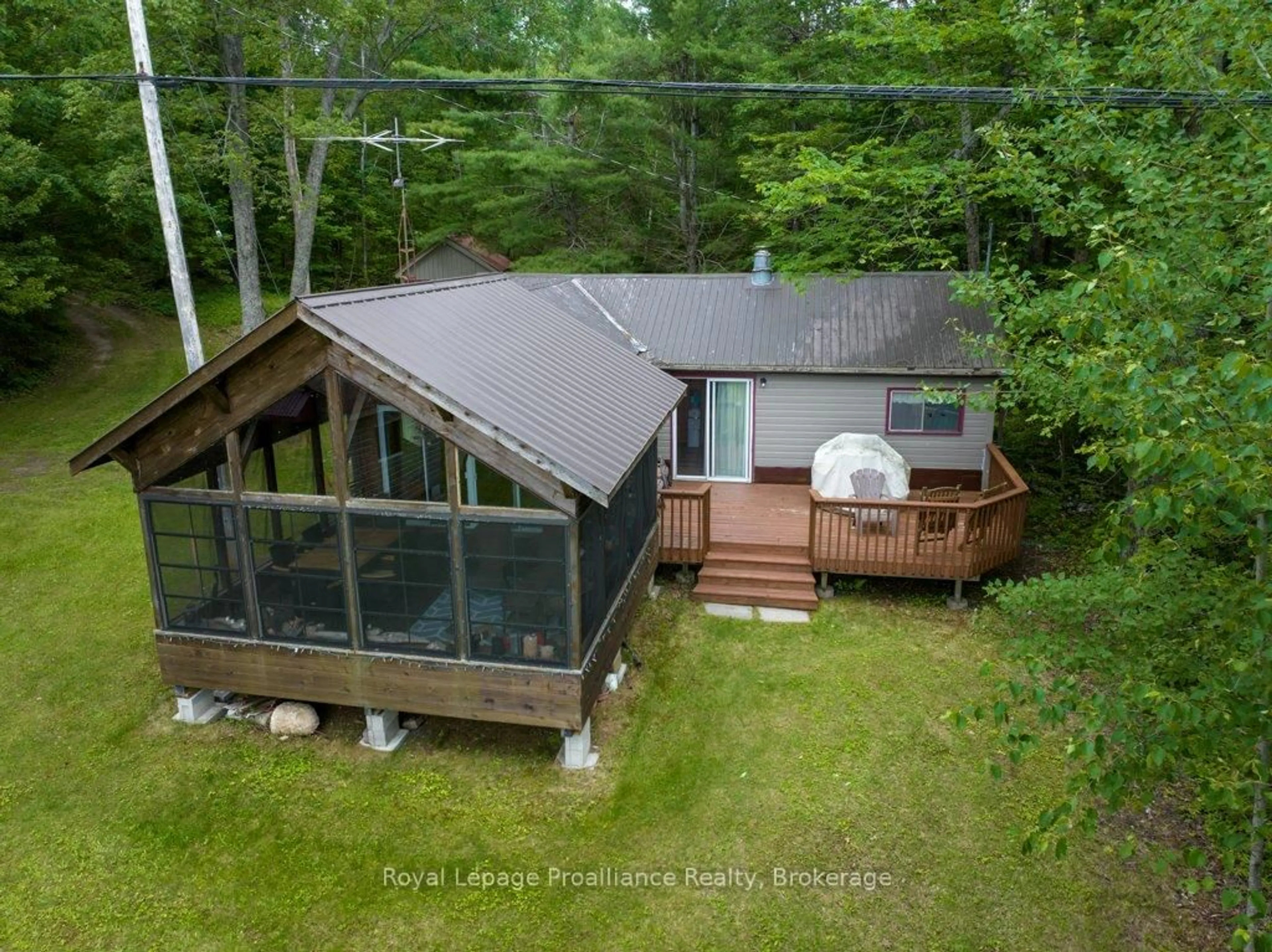 A pic from outside/outdoor area/front of a property/back of a property/a pic from drone, water/lake/river/ocean view for 1161 Hughes Landing Rd, Cloyne Ontario K0H 1K0