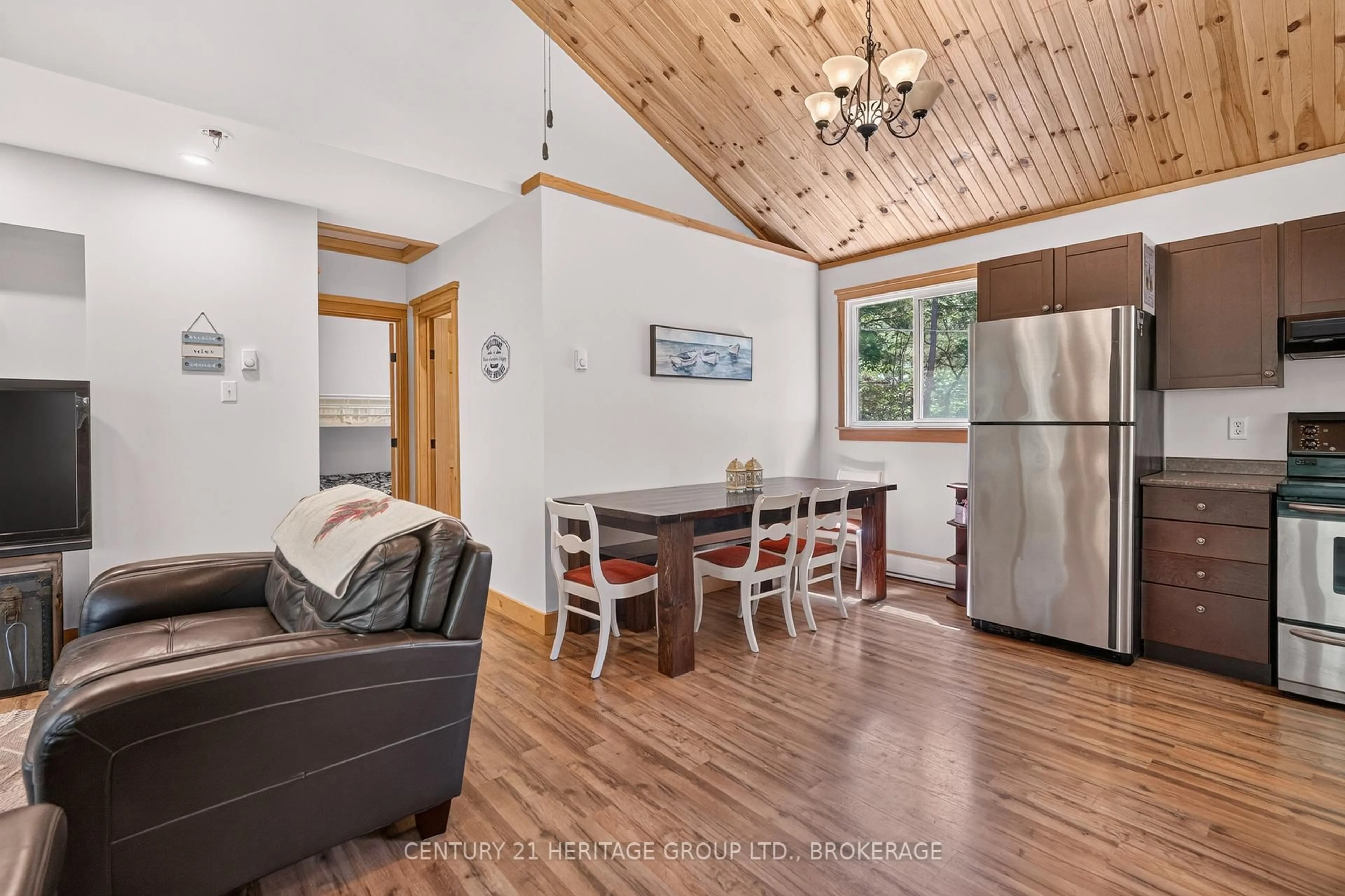 Open concept kitchen, wood/laminate floor for 27 Goods Island, Tichborne Ontario K0H 2V0
