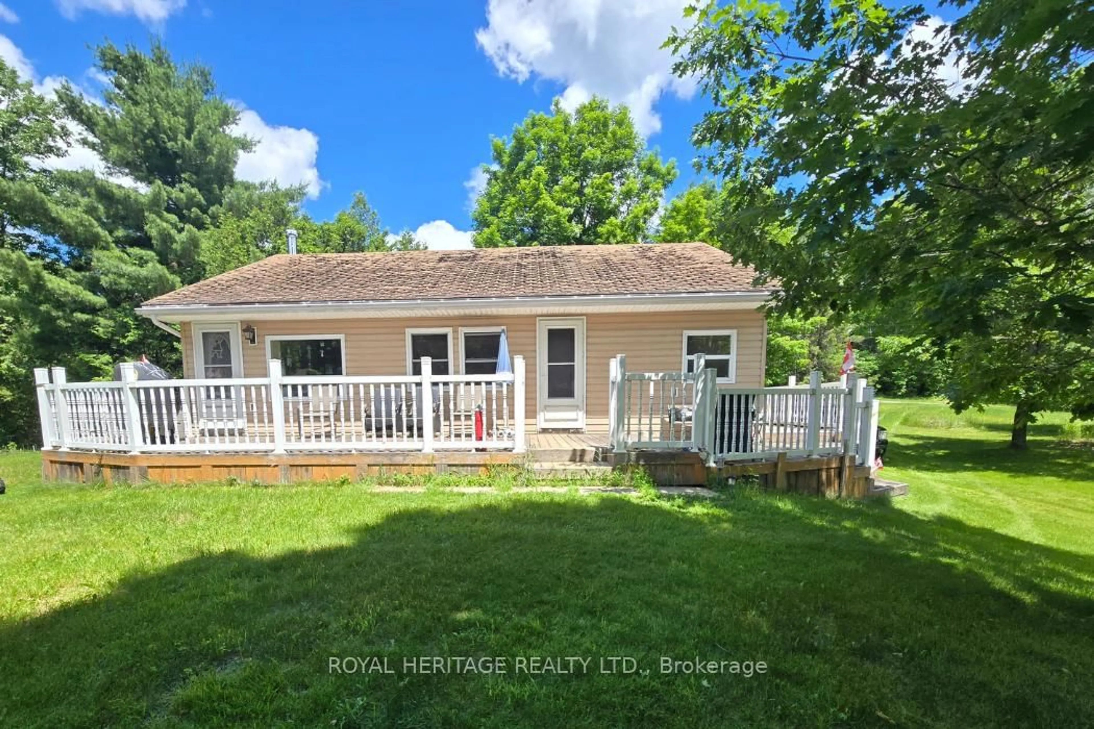 A pic from outside/outdoor area/front of a property/back of a property/a pic from drone, water/lake/river/ocean view for 1021 Spruce Tr #15, Arden Ontario K0H 1B0