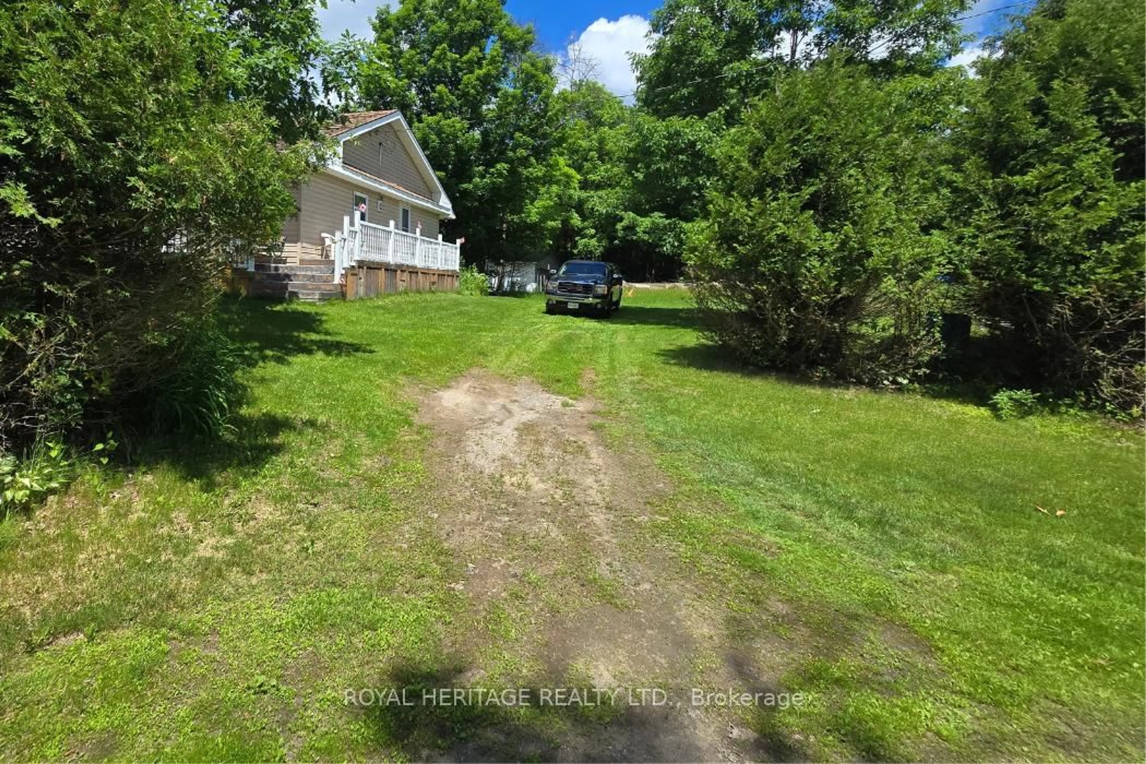 A pic from outside/outdoor area/front of a property/back of a property/a pic from drone, street for 1021 Spruce Tr #15, Arden Ontario K0H 1B0