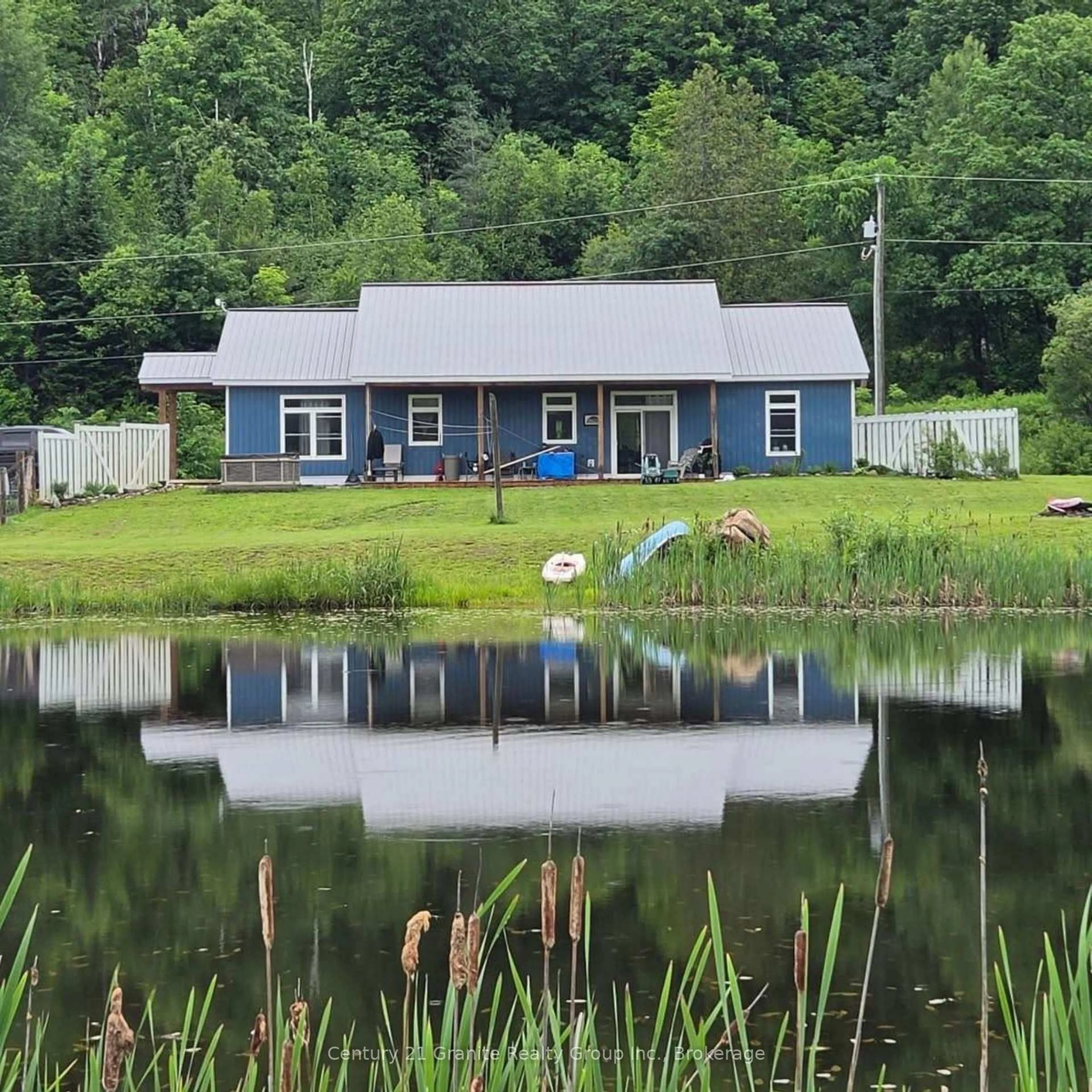 A pic from outside/outdoor area/front of a property/back of a property/a pic from drone, water/lake/river/ocean view for 704 Lakeview Rd, Bancroft Ontario K0L 1C0
