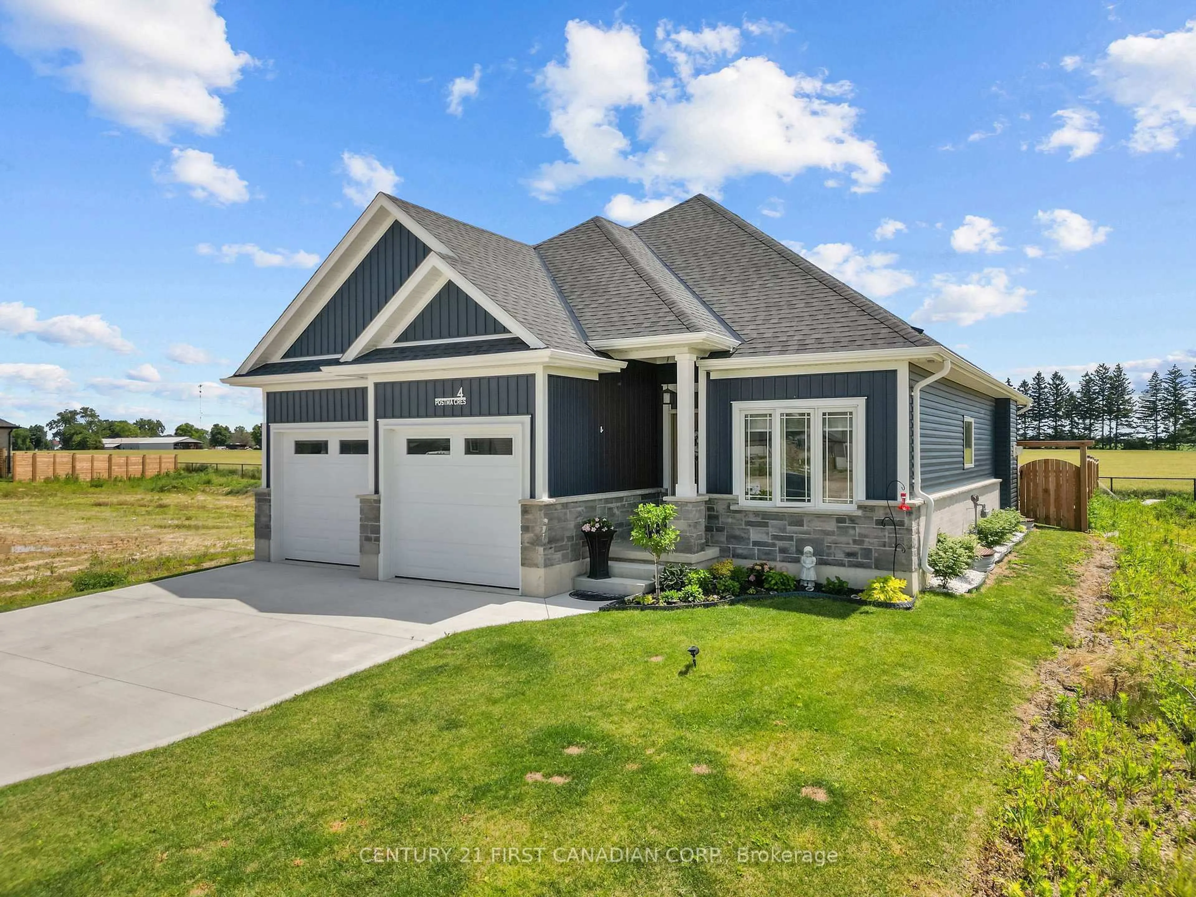 Home with vinyl exterior material, street for 4 Postma Cres, North Middlesex Ontario N0M 1A0