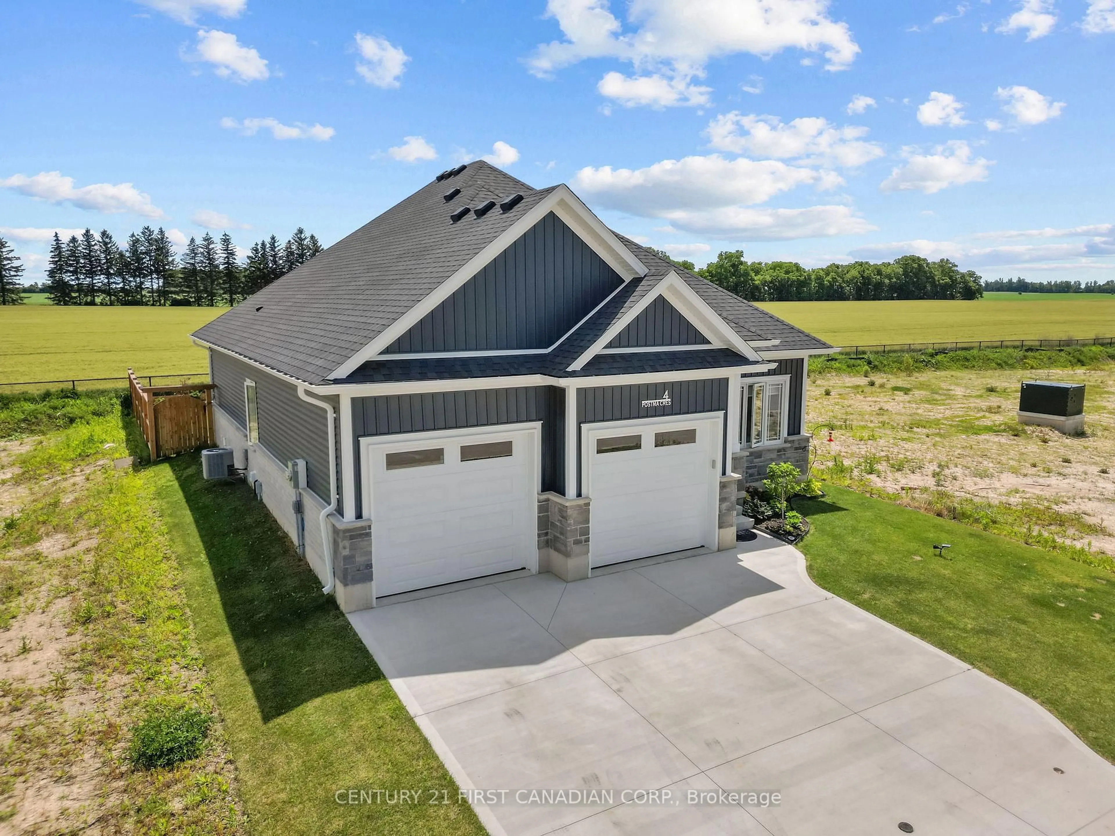 A pic from outside/outdoor area/front of a property/back of a property/a pic from drone, unknown for 4 Postma Cres, North Middlesex Ontario N0M 1A0