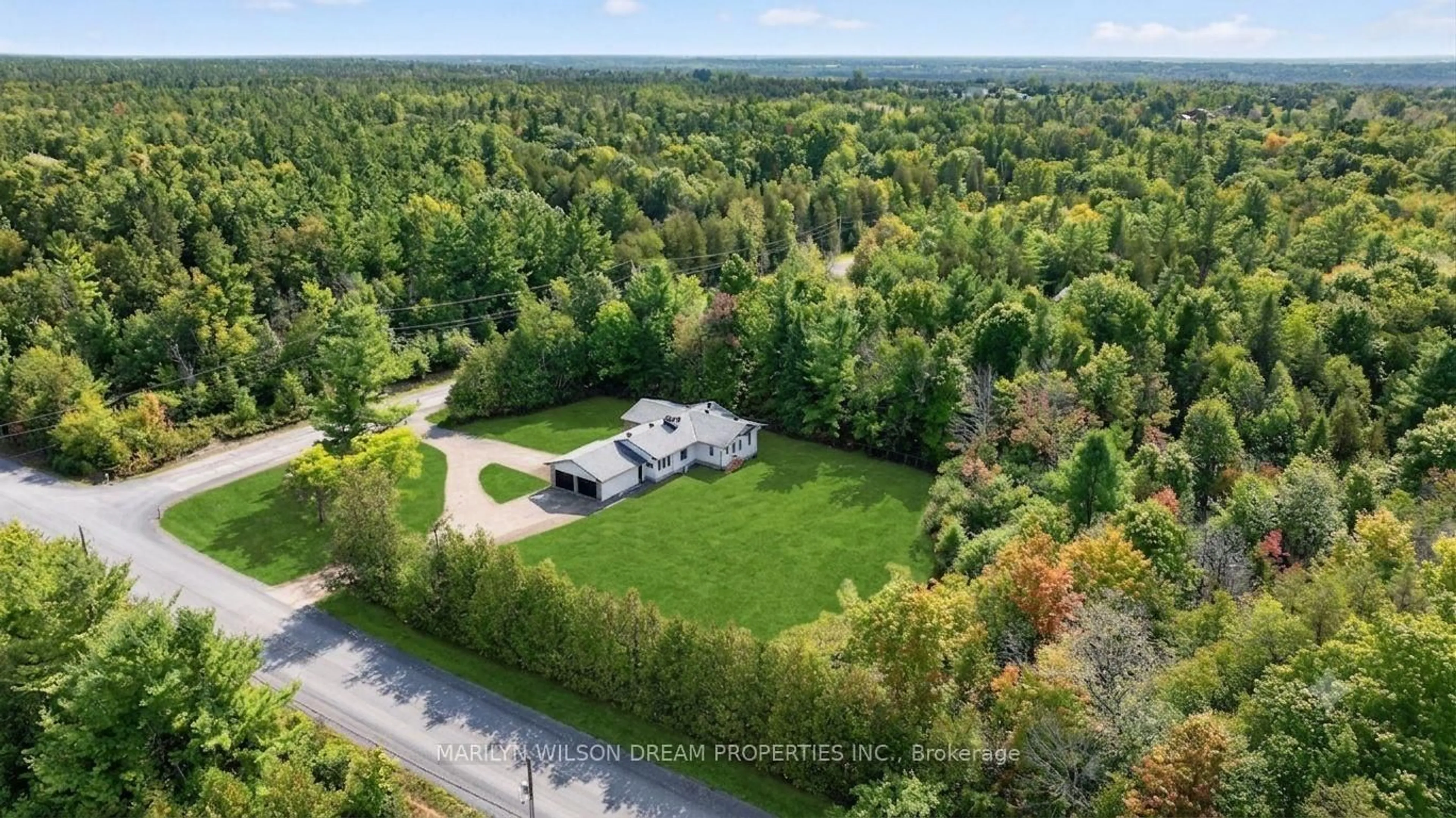 A pic from outside/outdoor area/front of a property/back of a property/a pic from drone, forest/trees view for 135 Manion Rd, Carp Ontario K0A 1L0