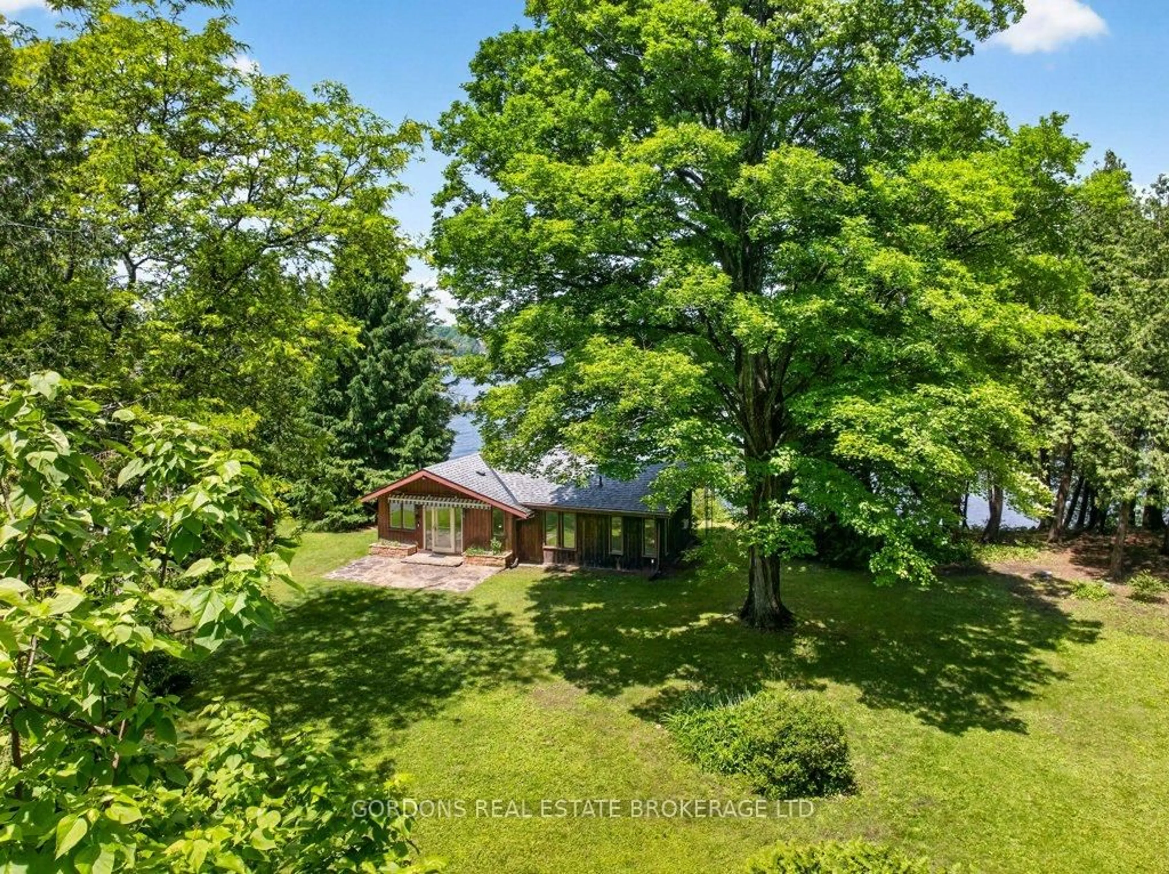 A pic from outside/outdoor area/front of a property/back of a property/a pic from drone, forest/trees view for 4444 Arthur Court Lane, Inverary Ontario K0H 1X0