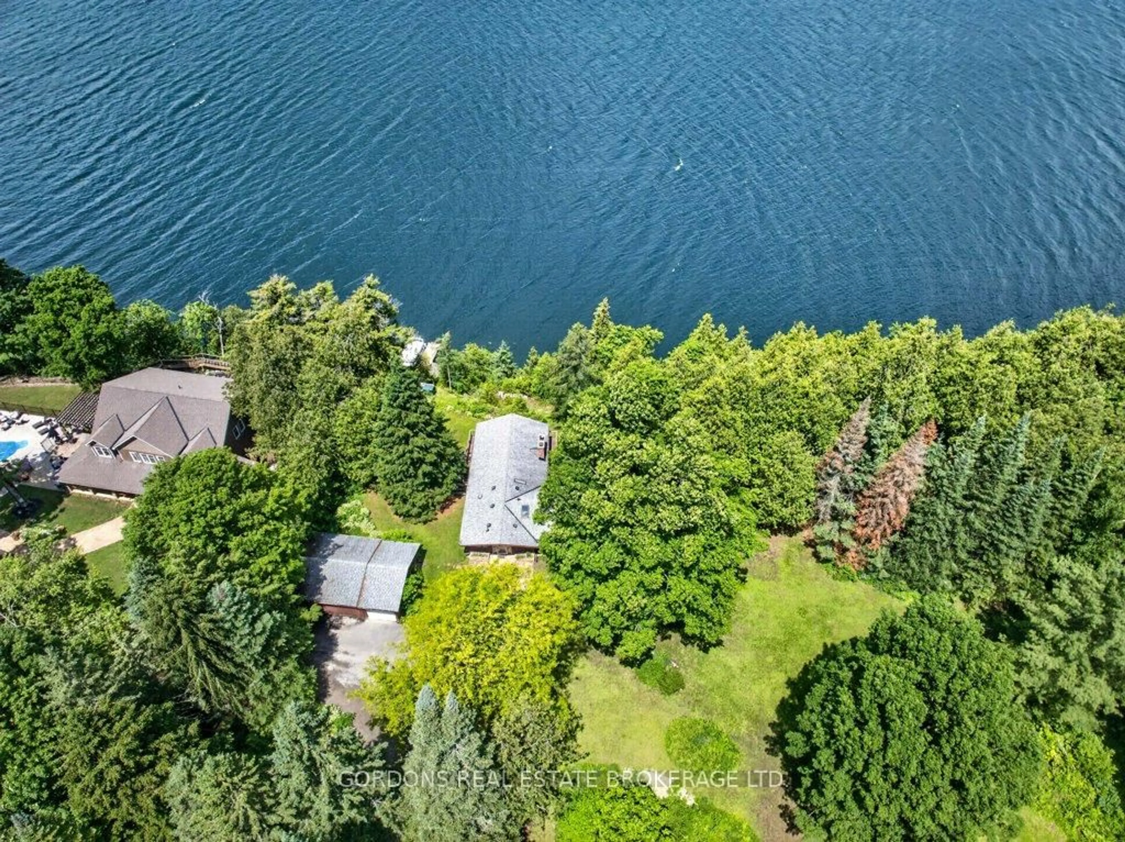 A pic from outside/outdoor area/front of a property/back of a property/a pic from drone, water/lake/river/ocean view for 4444 Arthur Court Lane, Inverary Ontario K0H 1X0