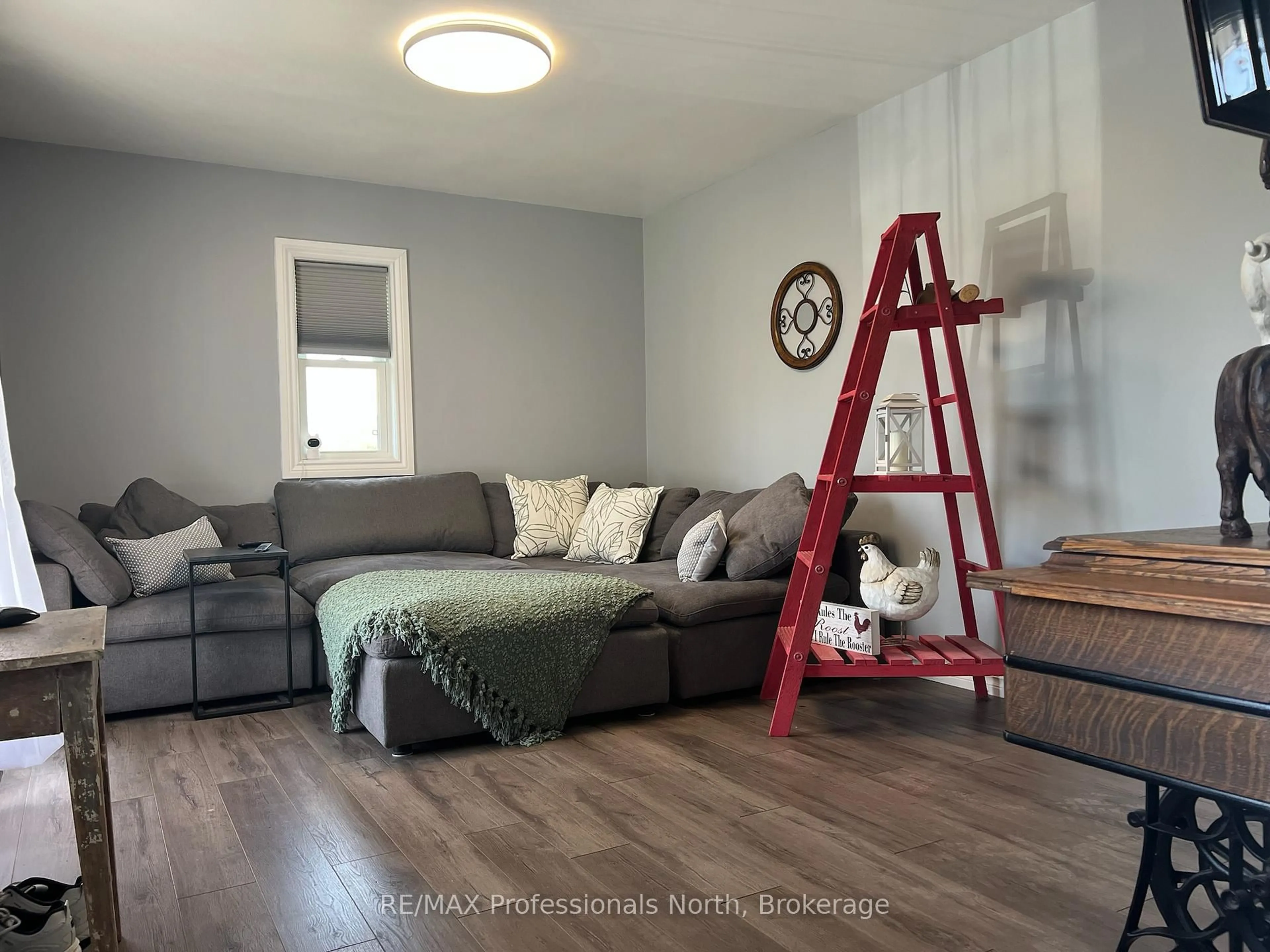 Living room with furniture, wood/laminate floor for 496 Pothier Rd, St. Charles Ontario P0M 2W0