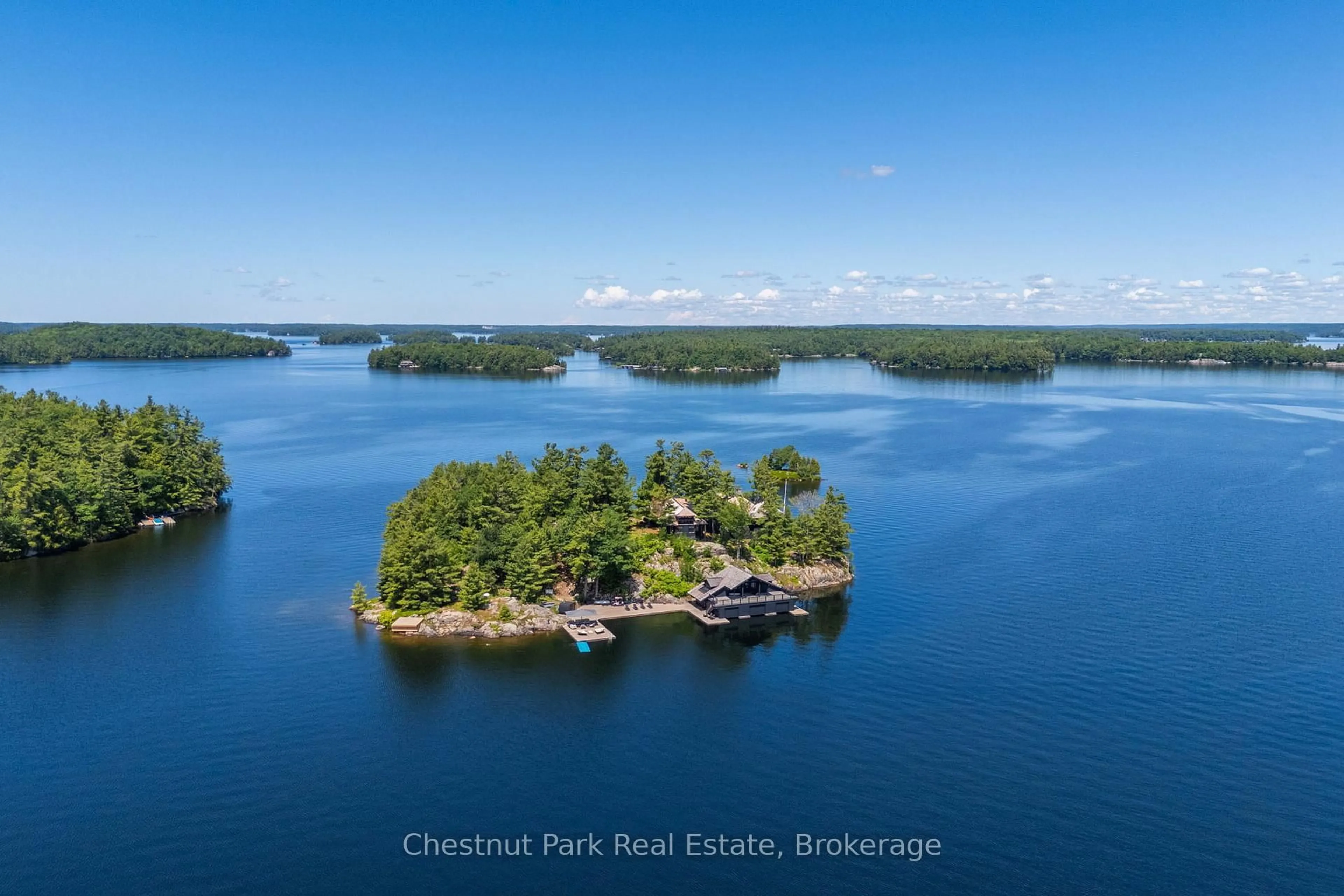 A pic from outside/outdoor area/front of a property/back of a property/a pic from drone, water/lake/river/ocean view for 1 ONAWAY ISLAND R21, Muskoka Lakes Ontario P0B 1J0